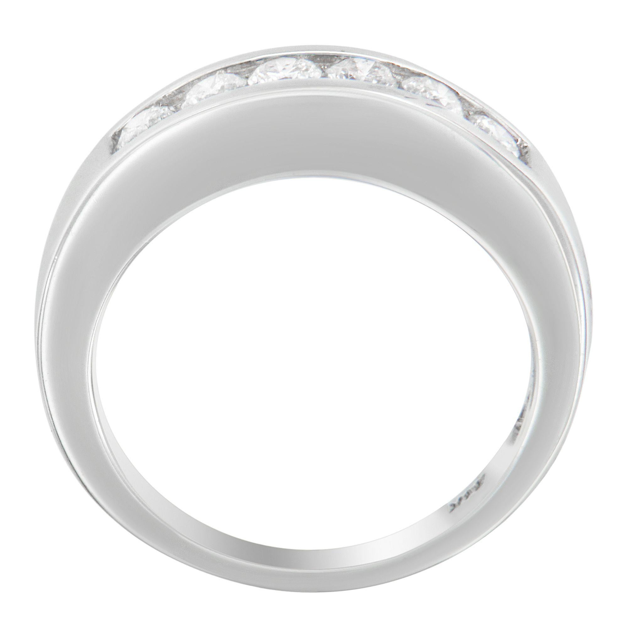 Bring more sophistication and style to your party look with this wonderful diamond band. Crafted out of 14k white gold, this fashion ring is lined with dazzling round-cut diamonds. Framed in channel settings, these diamonds are so captivating that