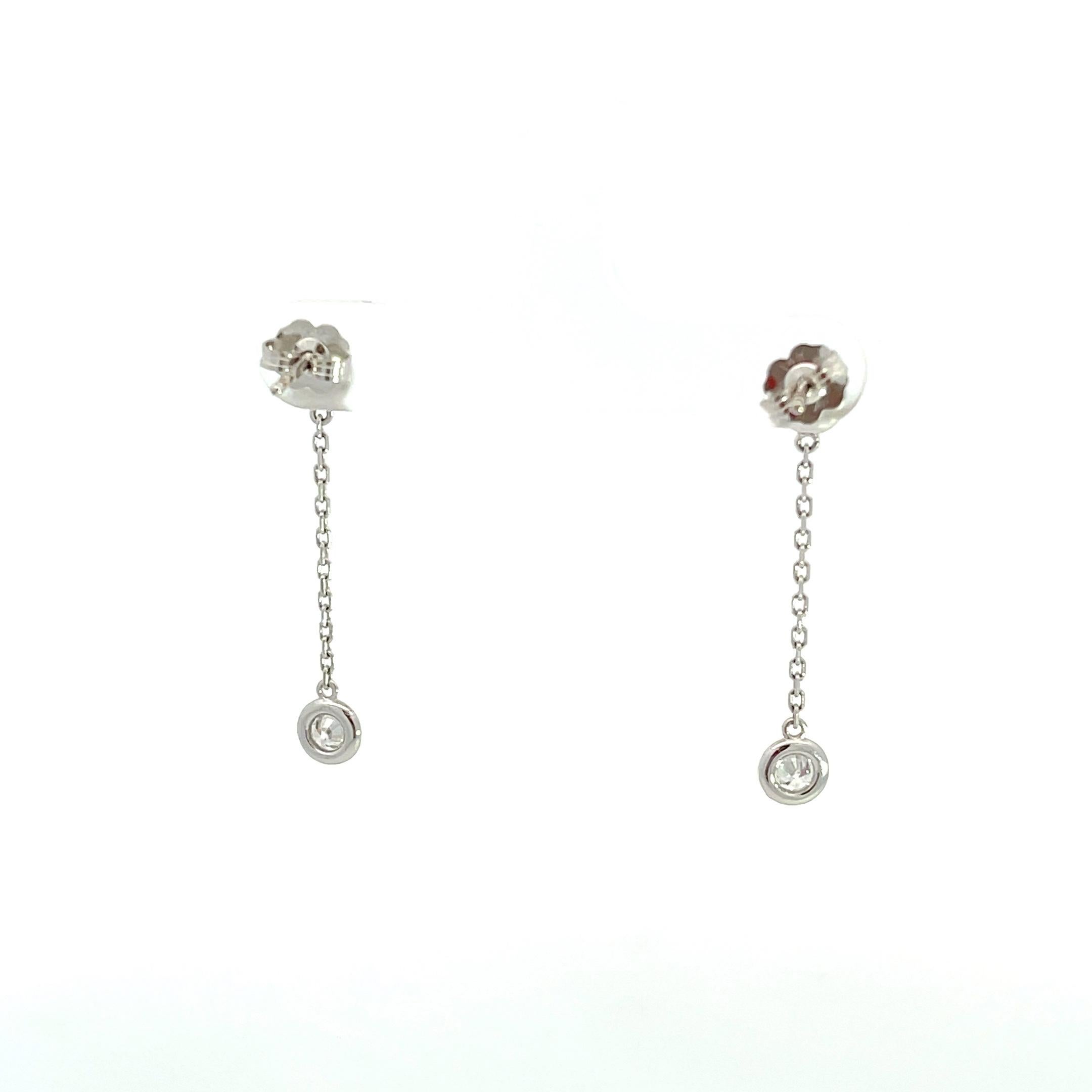 Introducing elegance redefined with our exquisite 14K White Gold 0.75ctw Diamonds by the Yard Drop Earrings. Radiate timeless charm and sophistication with these captivating earrings that effortlessly blend classic design with modern flair. Crafted
