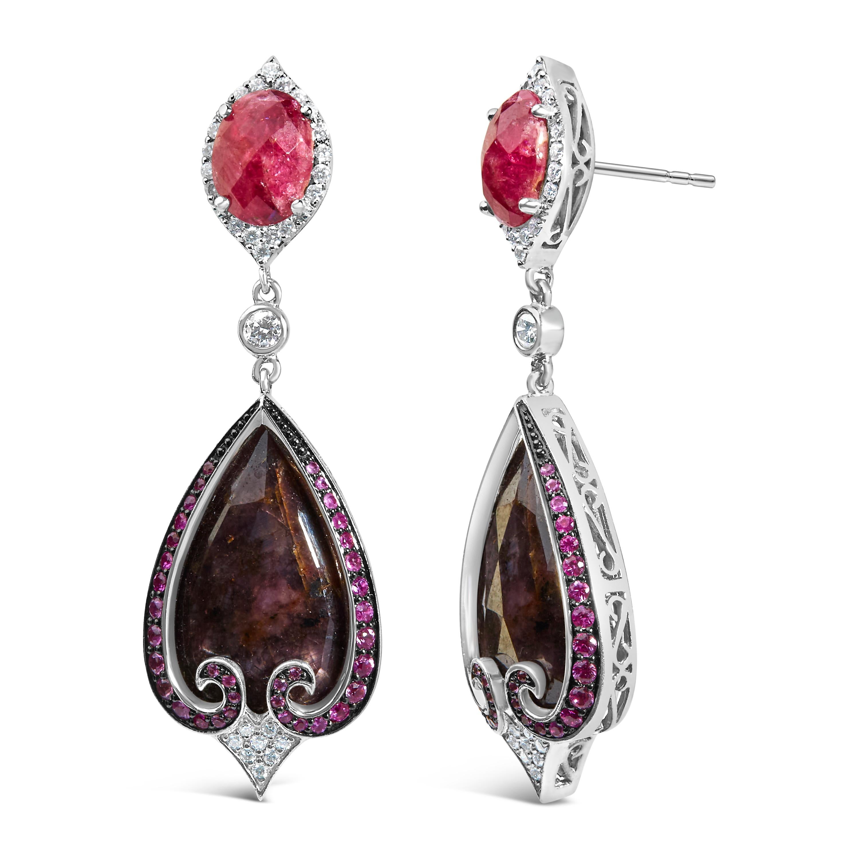 Discover the elegance of yesteryear with these exquisite 14K white gold drop earrings, radiating sophistication with a modern twist. These treasures are meticulously crafted with rhodium-plated finishes, promising an everlasting shine that captures