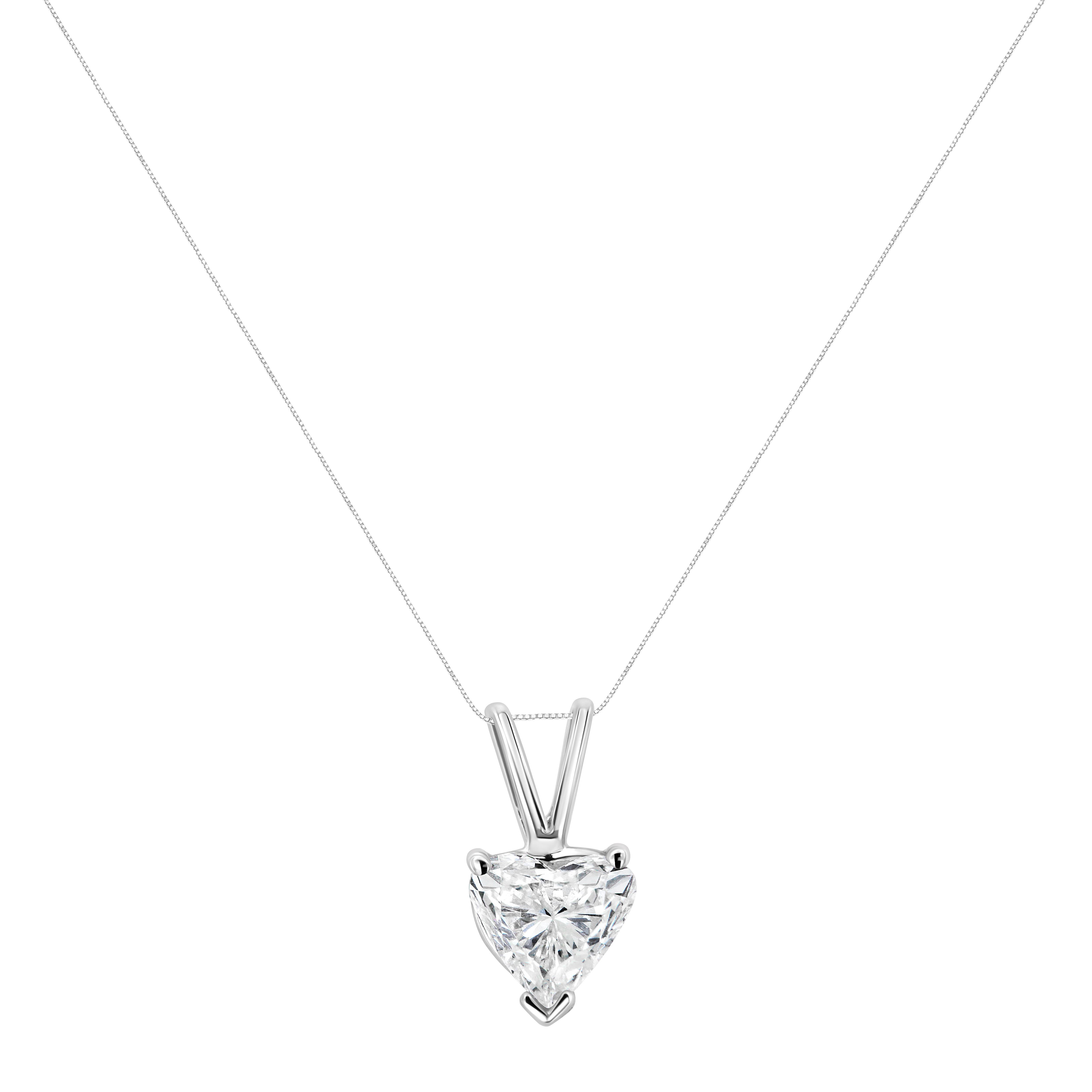 An elegant heart-shaped diamond is the brilliant focal point of this solitaire necklace for her. Set in 14K white gold, the diamond suspends from an 18-inch cable chain that secures with a spring ring. The simplicity of a perfect diamond will