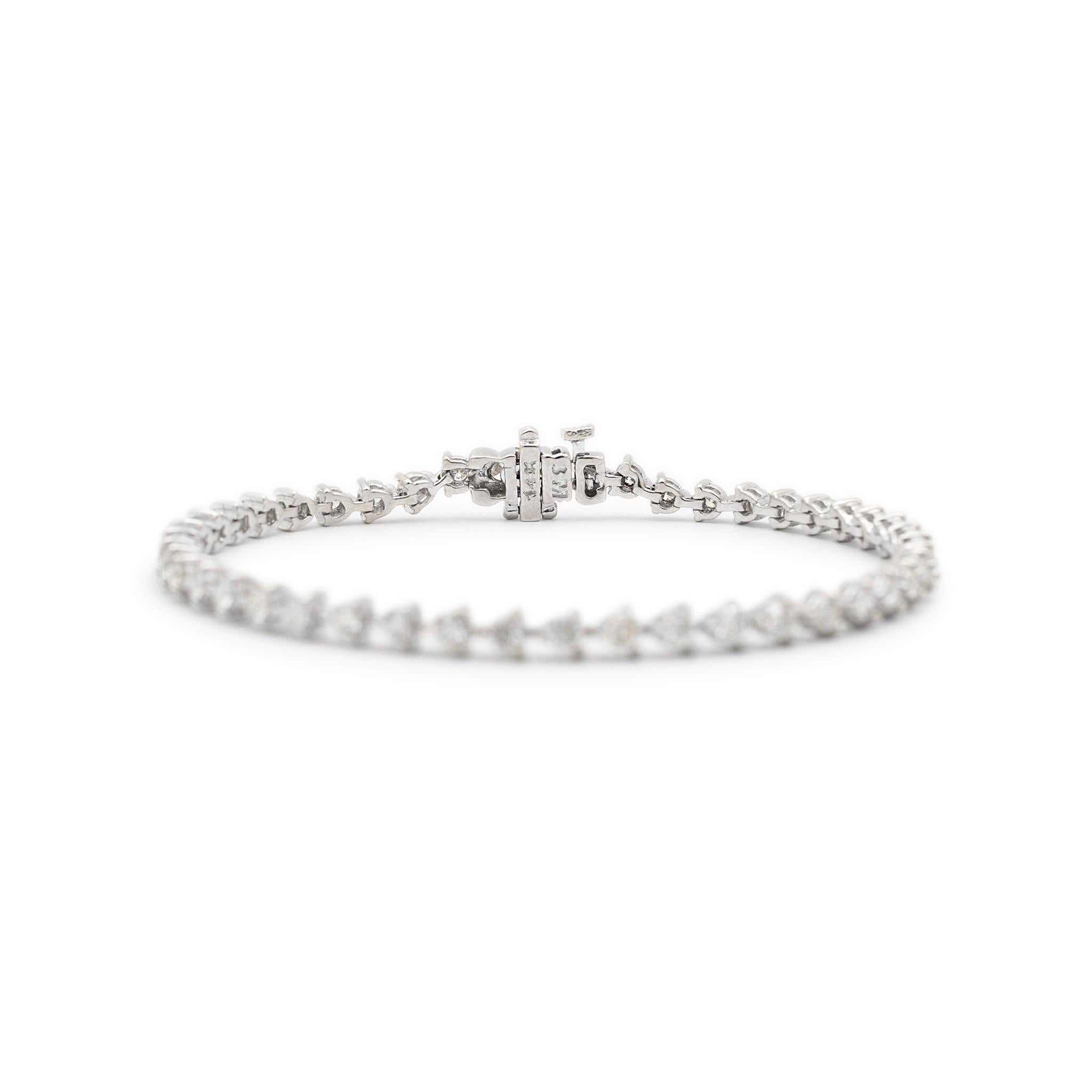 Metal Type: 14K White Gold

Length: 7.00 inches

Width: 4.00 mm

Weight: 10.40 grams

14K white gold, diamond tennis bracelet. The metal was tested and determined to be 14K white gold, Engraved with 