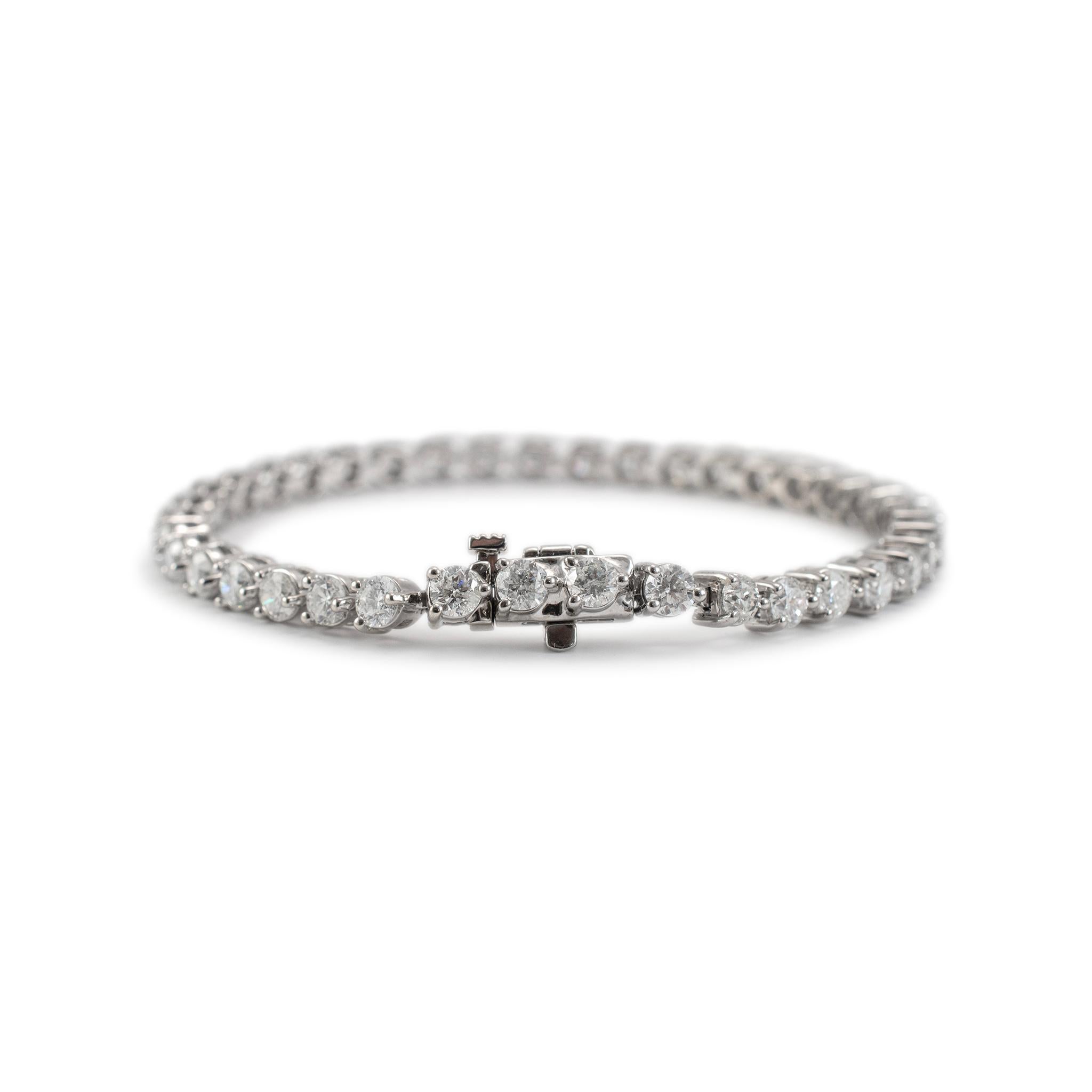 Gender: Ladies

Metal Type: 14K White Gold

Length: 7.00 inches

Width: 4.00 mm

Weight: 13.81 Grams

14K white gold diamond tennis bracelet. The metal was tested and determined to be 14K white gold. Engraved with 