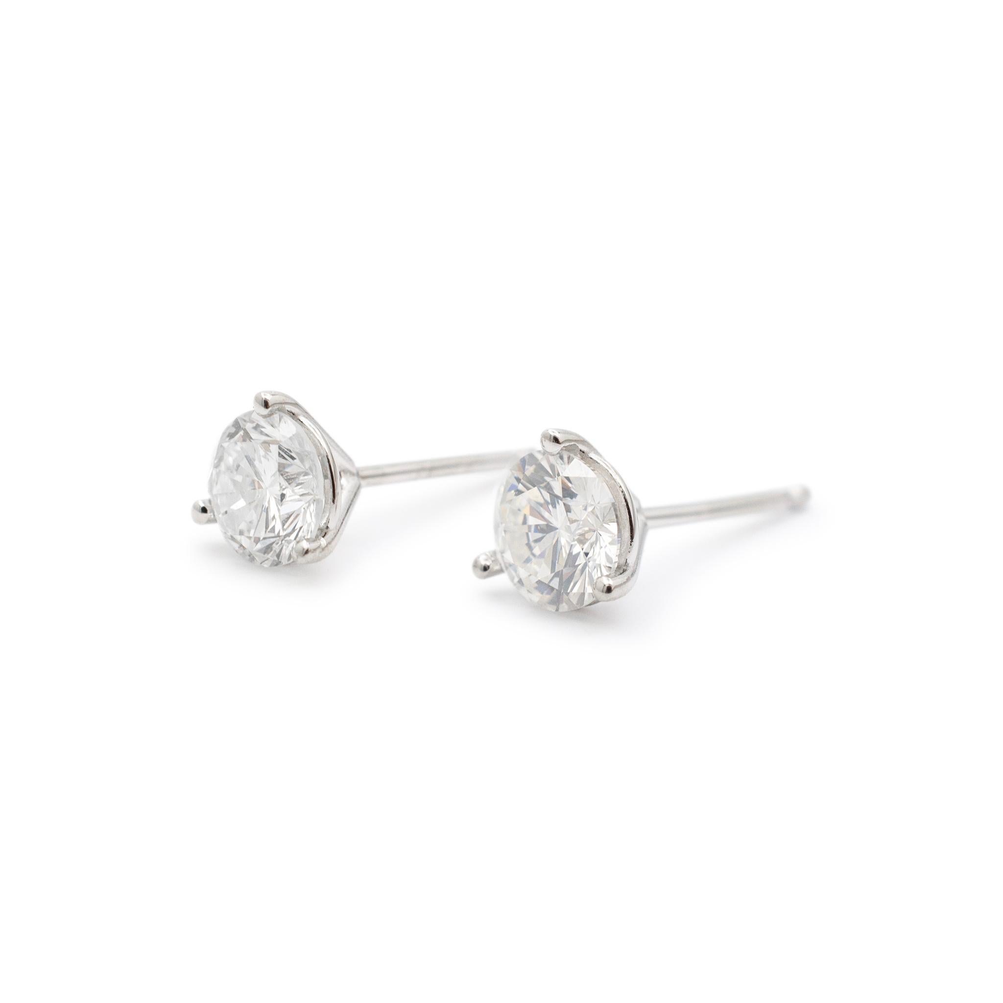 Gender: Ladies

Metal Type: 14K White Gold

Length: 0.50 Inches

Diameter: 4.90 mm

Weight: 0.70 Grams

Ladies 14K white gold diamond stud earrings with push backs. The metal was tested and determined to be 14K white gold. Engraved with