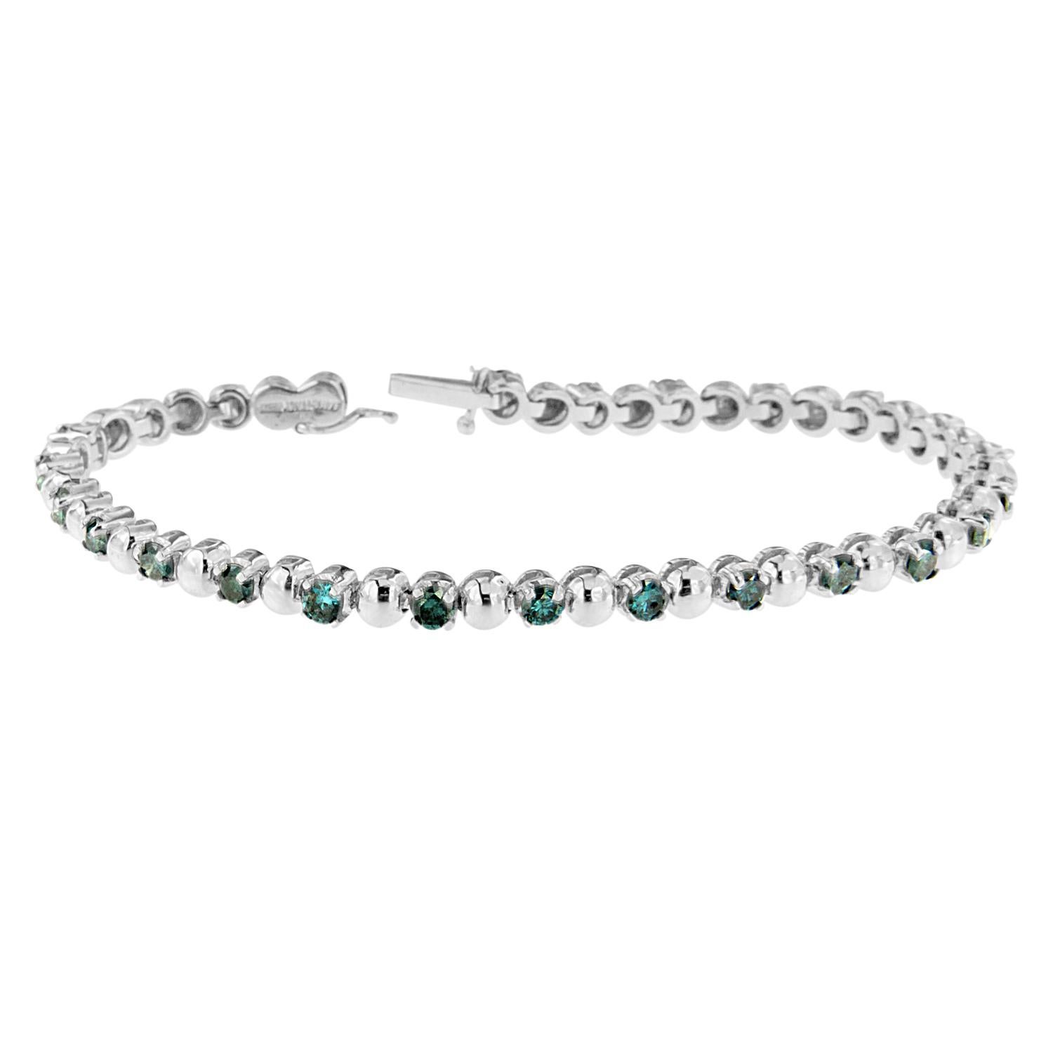 Say it vintage-styled, glamorous, or sparkling - this fabulous diamond tennis bracelet has it all. Crafted of rich 14 karats white gold, the dazzling design features an embellishment with royal and shimmering blue round cut diamonds. Every