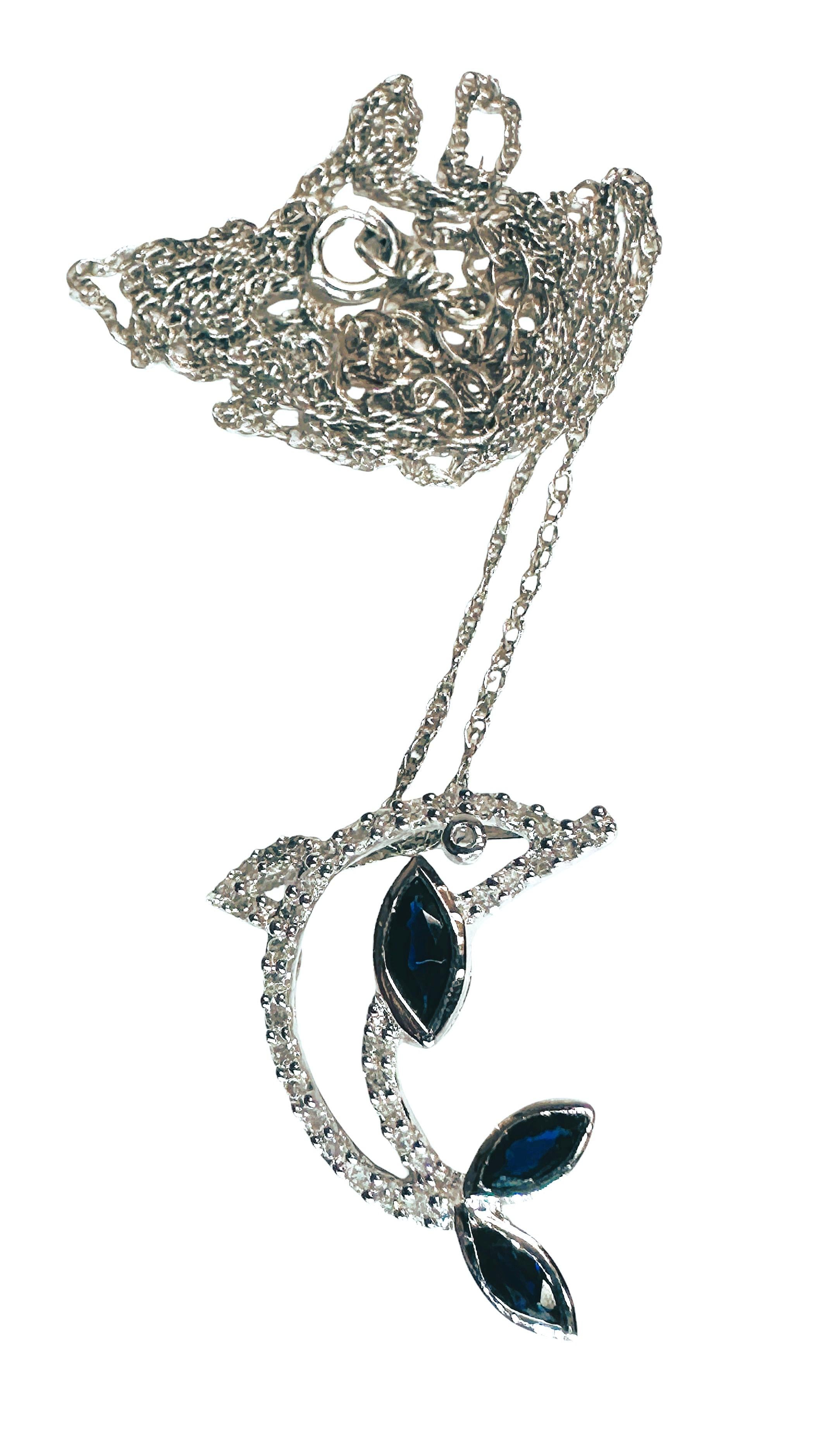 This is a very different type of dolphin pendant.  It's very unique in that it has .30 carats of marquise cut sapphire stones and the rest of the pendant is filled with brilliant cut diamonds.  The pendant is stamped 