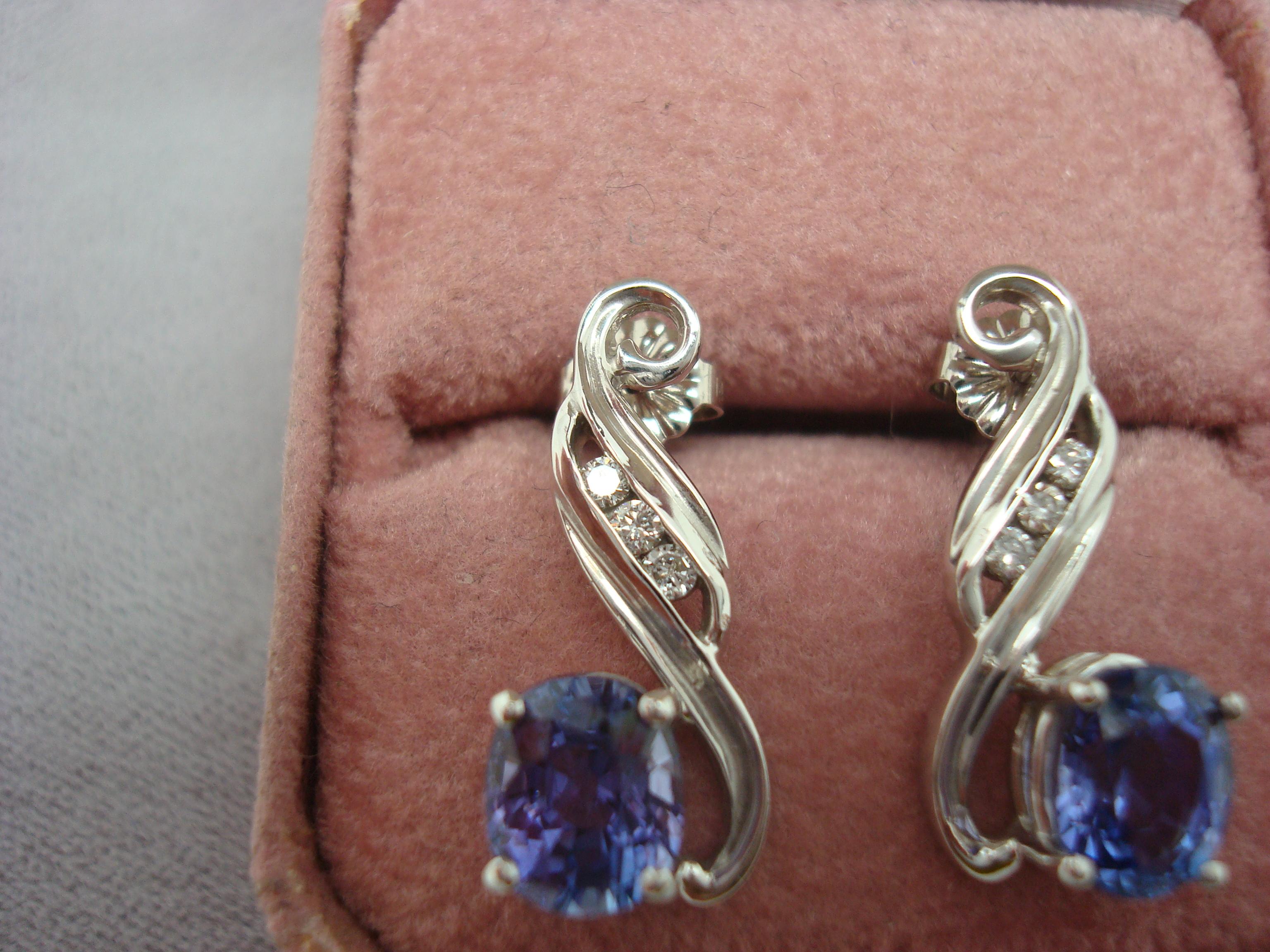 14k White Gold 3.2ct Genuine Natural Tanzanite and Diamond Earrings (#J1815)

14k white gold tanzanite and diamond drop earrings featuring a pair of oval cut tanzanites weighing 3.2 carats total, which is over 1 1/2 carats each! Both tanzanites