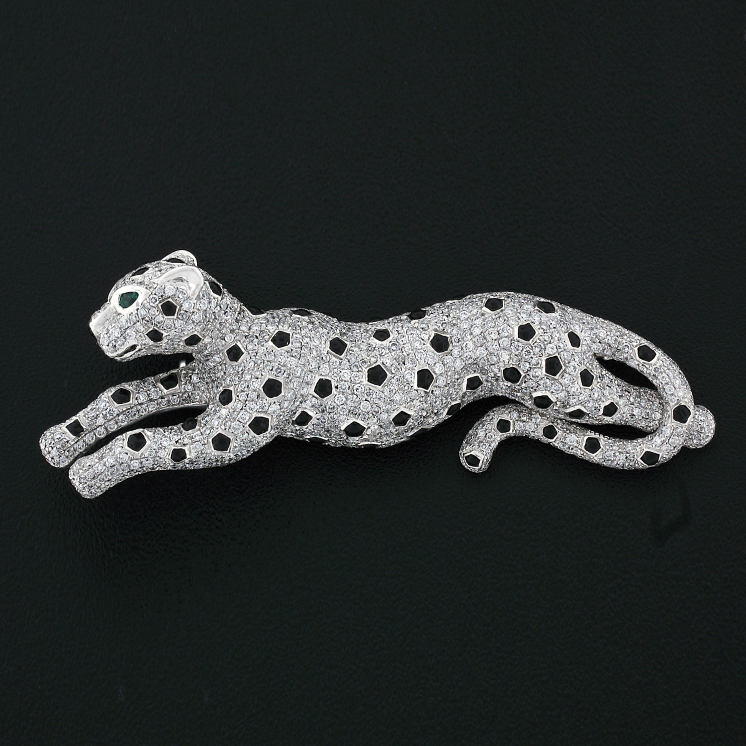 This gorgeous vintage brooch was crafted from solid 14k white gold and features a magnificently detailed leaping Panther/leopard design. The body of the Panther/leopard is drenched with exactly 3.30 carats of perfectly pavé set round brilliant cut