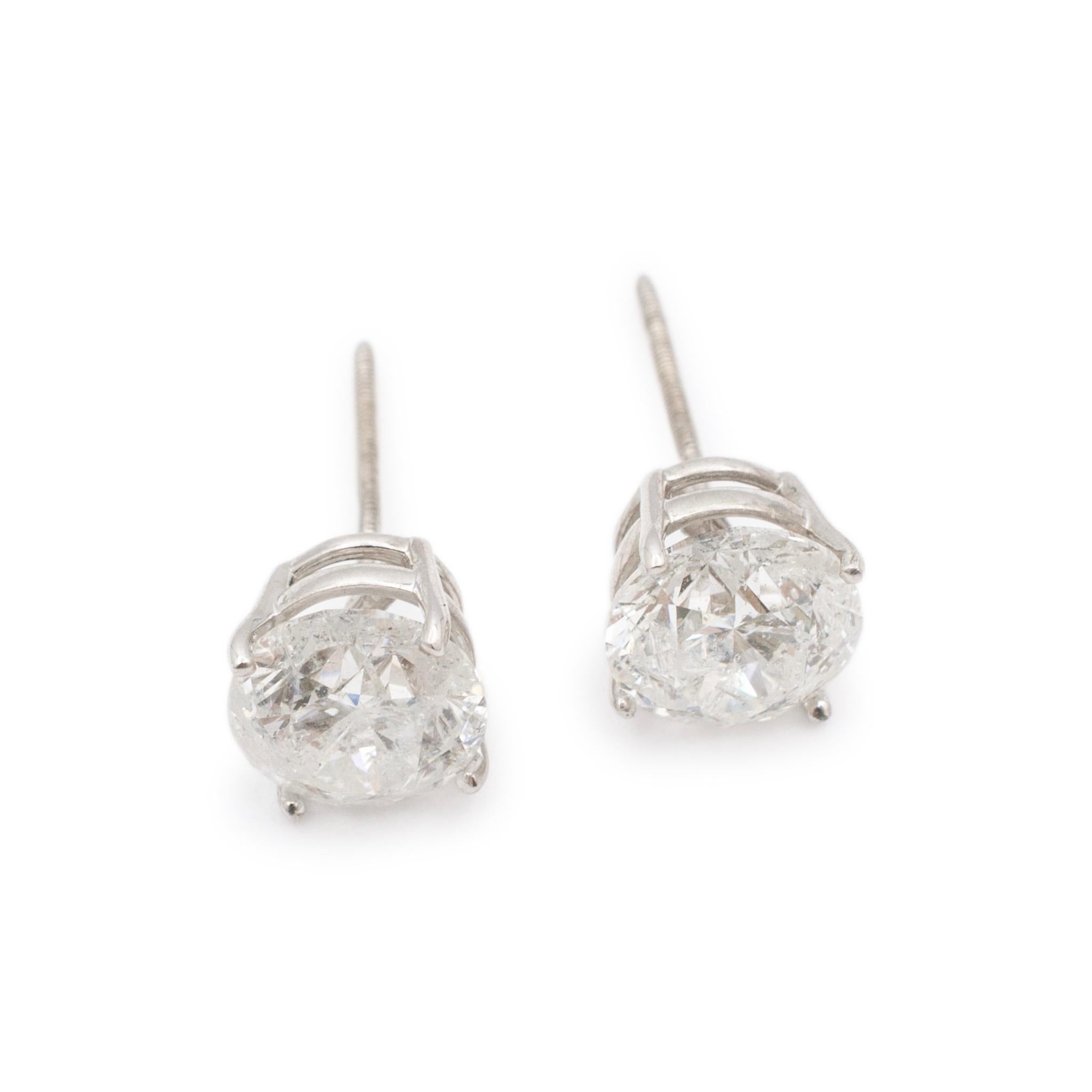 Gender: Ladies

Metal Type: 14K White Gold

Length: 0.25 inches

Diameter: 7.50 mm

Weight: 1.82 grams

14K white gold, diamond stud earrings with screw backs Engraved with 
