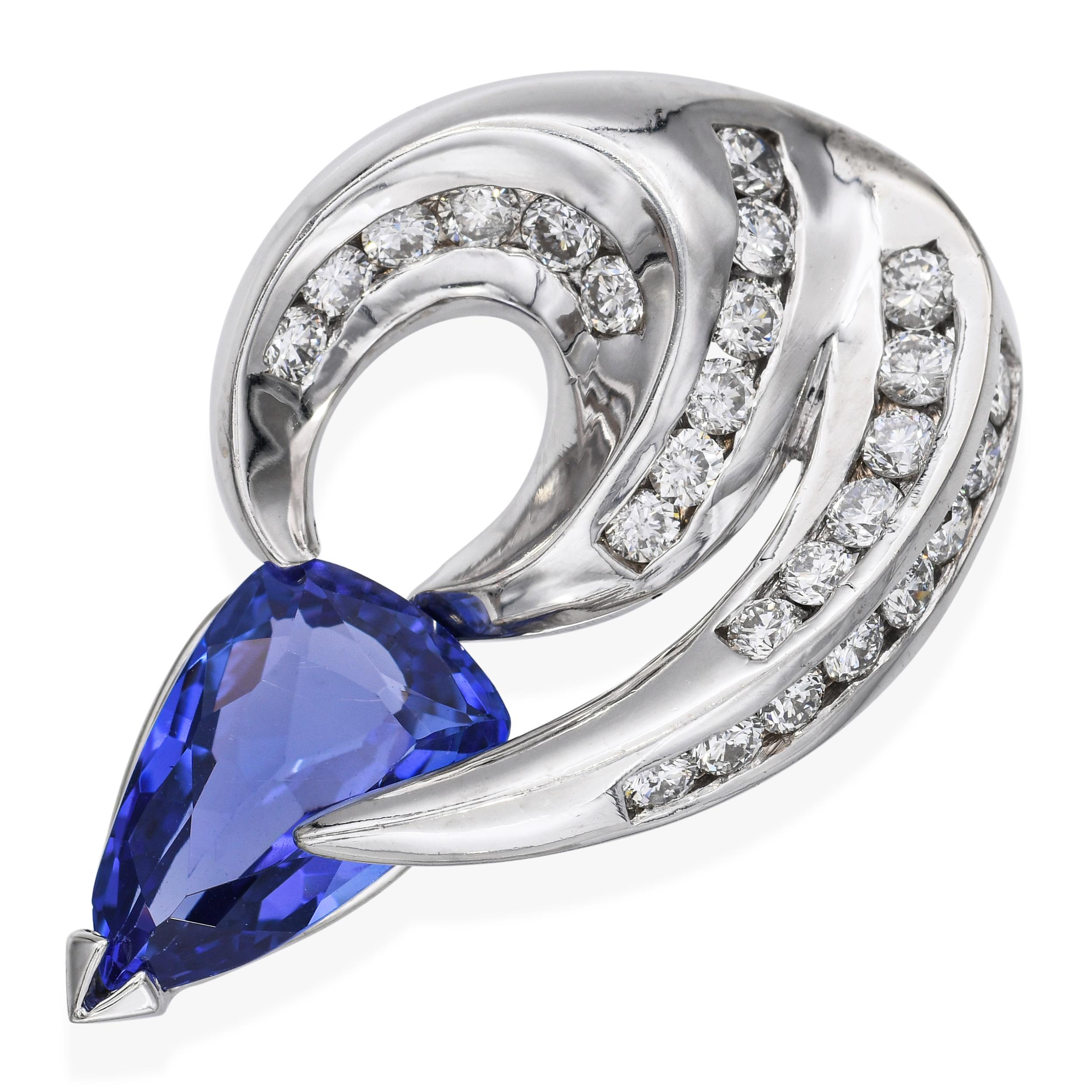 A striking 14k white gold pendant showcasing a vivid 3.58ct tanzanite held in bold claw-like prongs. Surrounding the center stone are 0.78tcw of bright white diamonds, channel set along the tapering body for added brilliance and structure. The deep