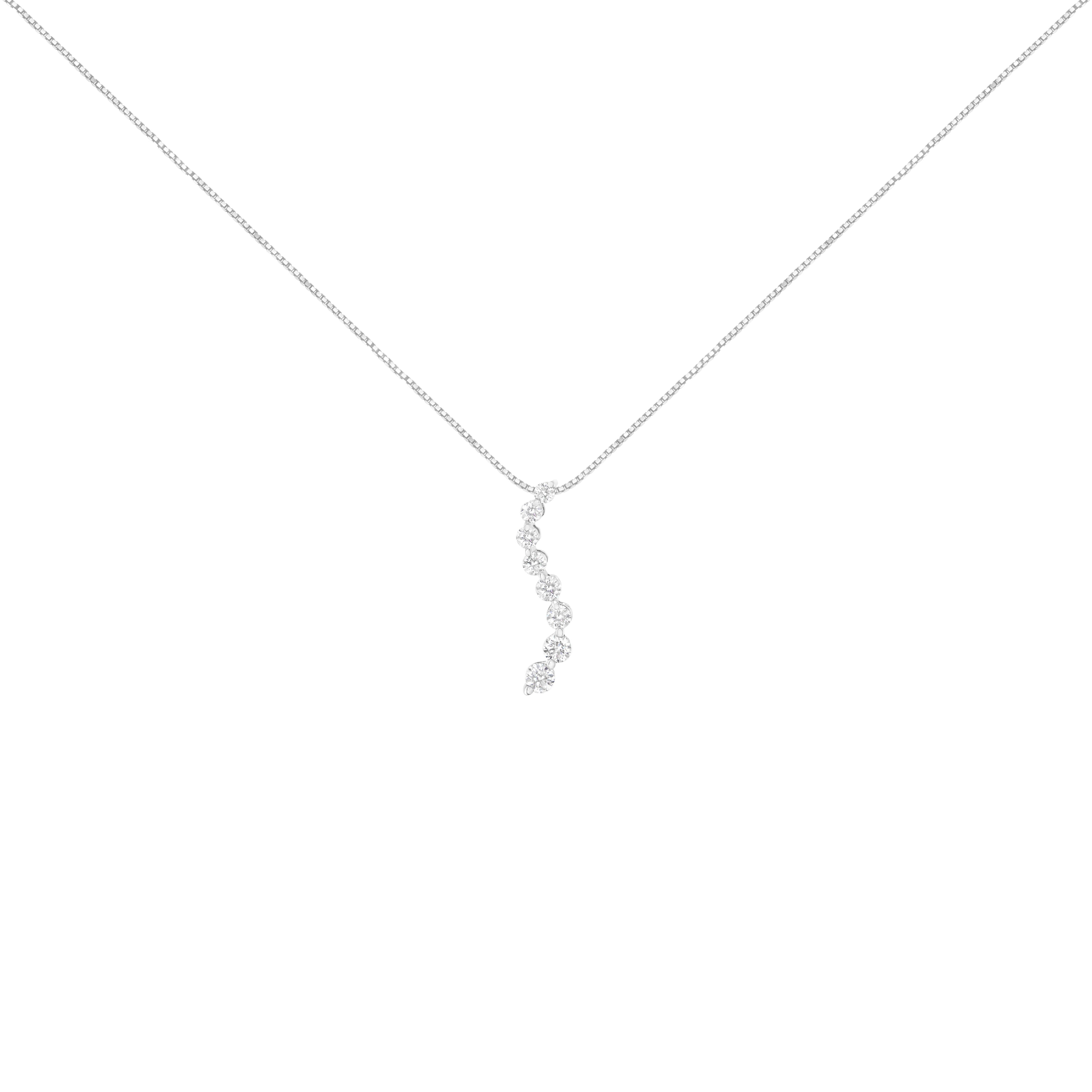 Fetch the attention of everyone at next party by wearing this dazzling neckpiece. This 14-karats white gold pendant is highly polished to shine for a bright radiance. It features a gentle wavy design, adorned with round cut diamonds on the front and