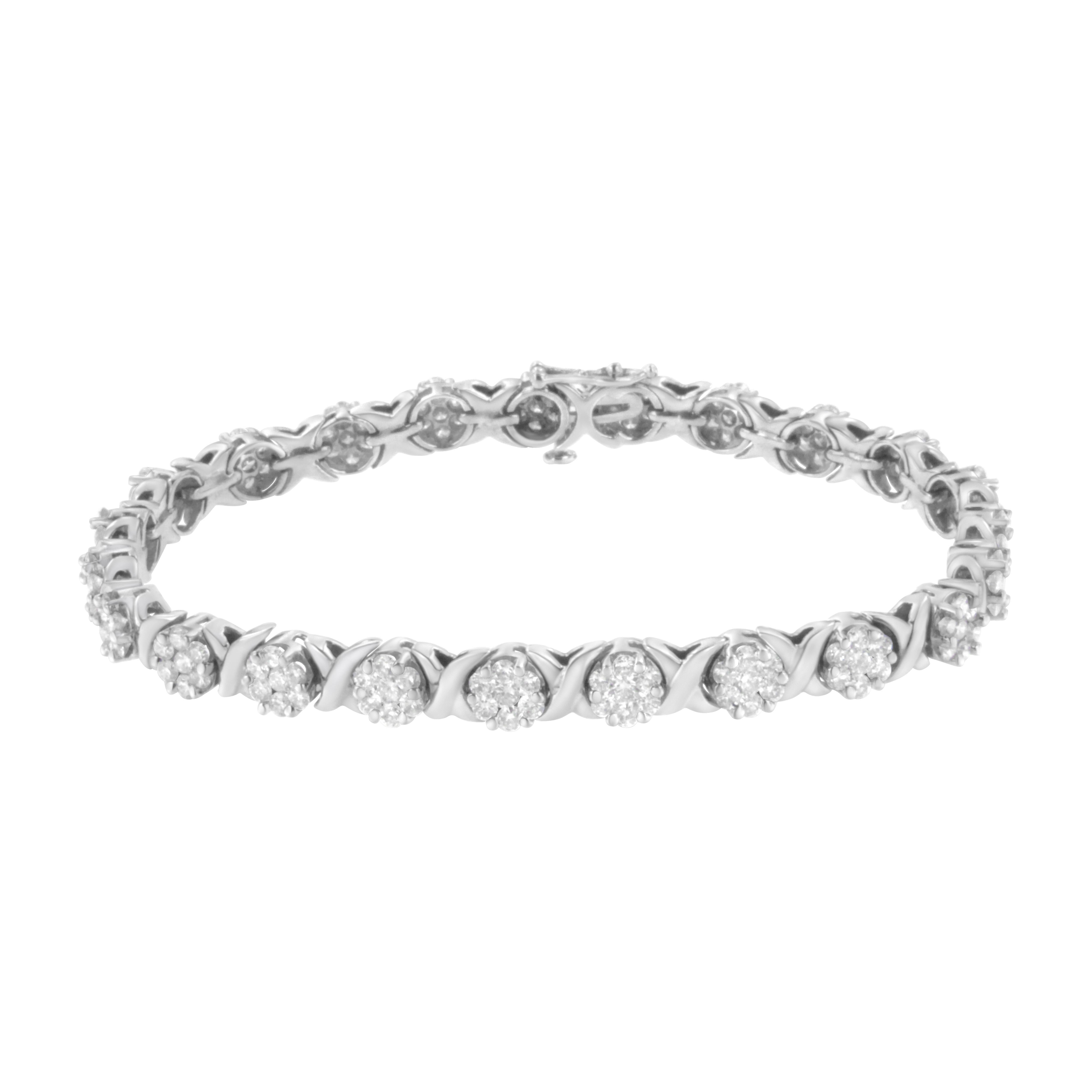 Embellish your wrist with this elegant 4 7/8ct TDW diamond link bracelet. Each X link is crafted from cool 14kt white gold and alternates with a floral diamond cluster in this gorgeous design. 161 round cut diamonds sparkle in this 14k white gold