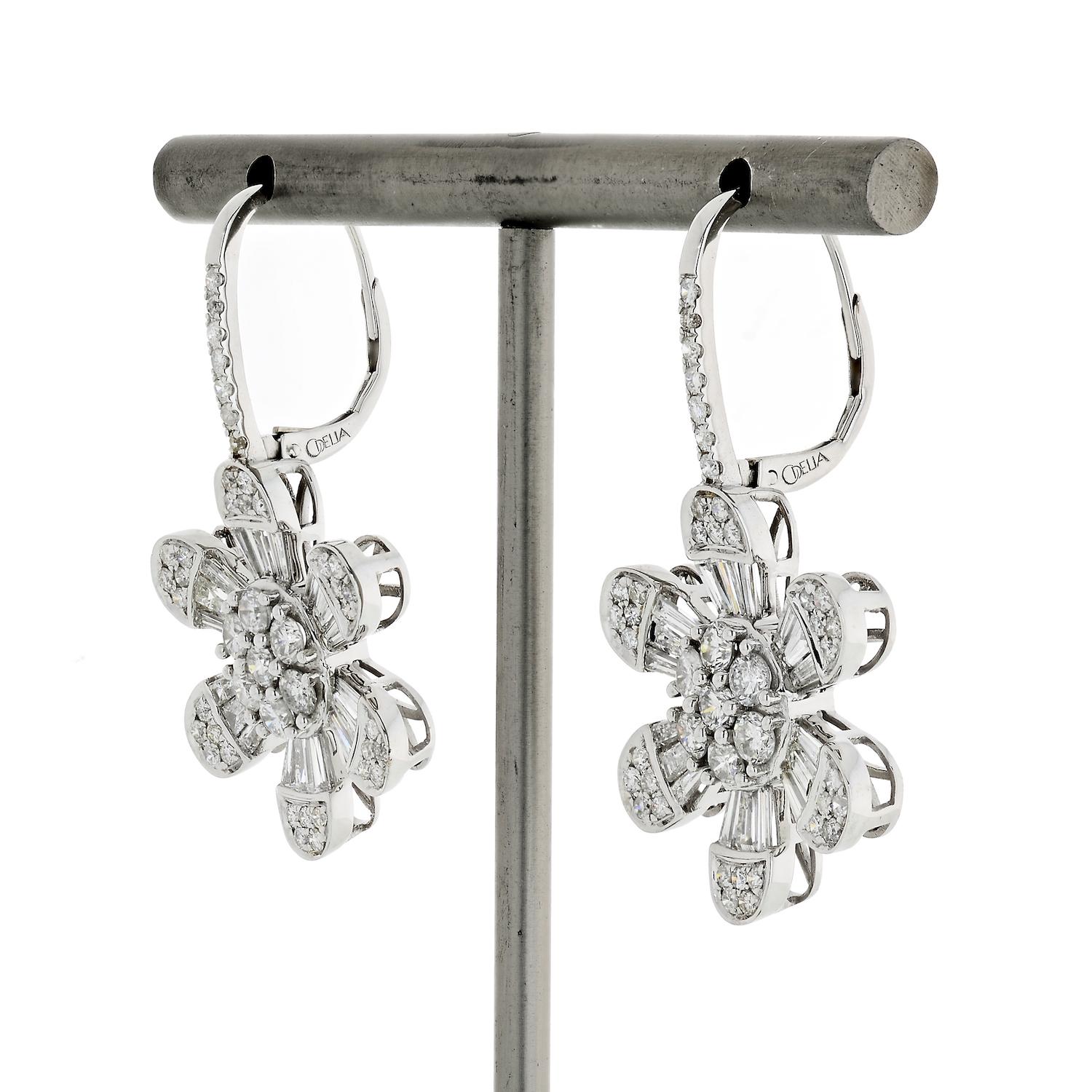 Delicate and dainty these 14k white gold diamond earrings are crafted in flower motif and are set with 4.08cts of diamonds. 
Finished with: Lever backing.
L: 35mm
