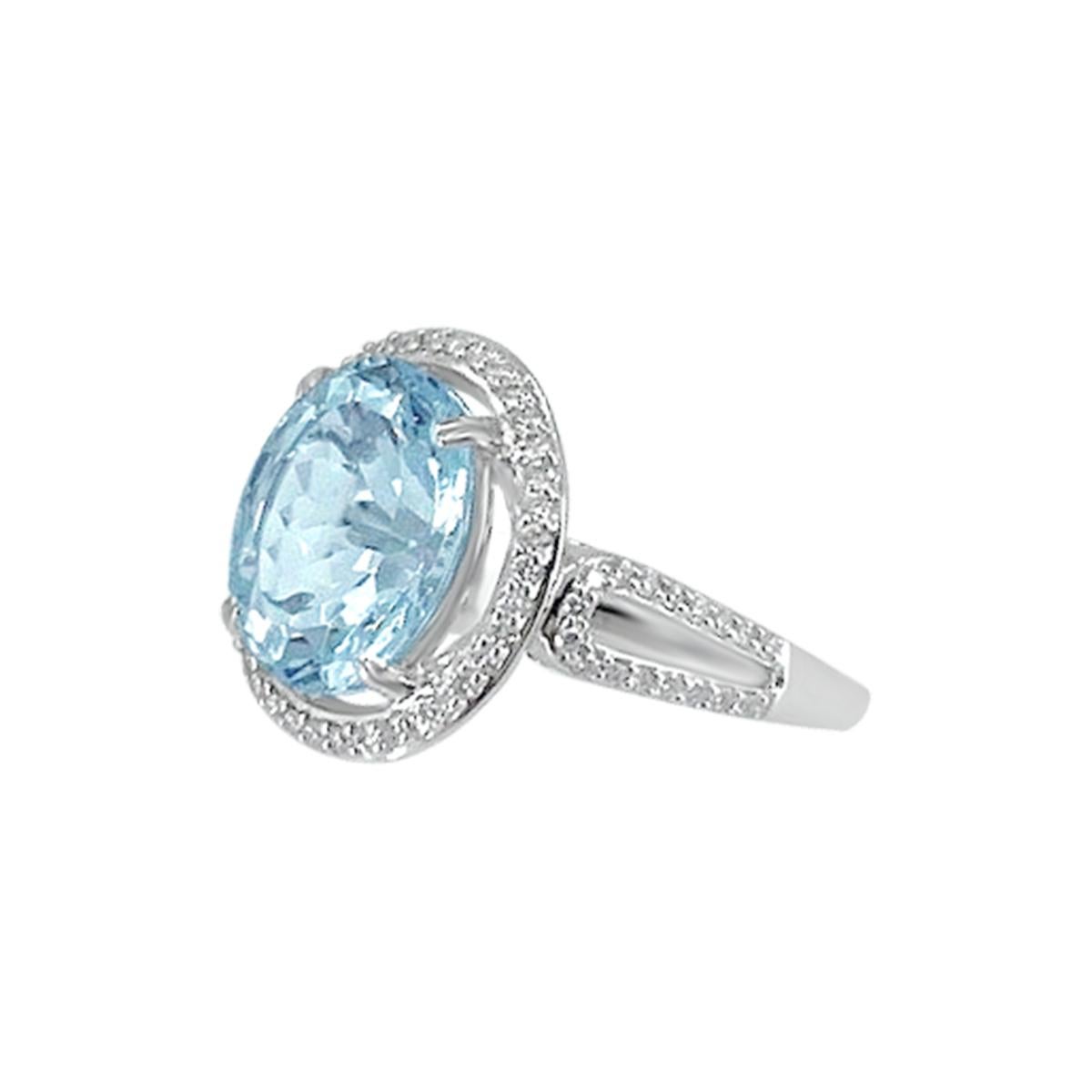 Vintage Style Inspired Aquamarine And Diamond Ring Is Crafted In 14K White Gold With A 4.22Cts Oval Cut 12x10mm Aquamarine Center For A Glamorous And Elegant Look. It's Unique Band With Diamonds Elegantly Contours The finger.

Style#