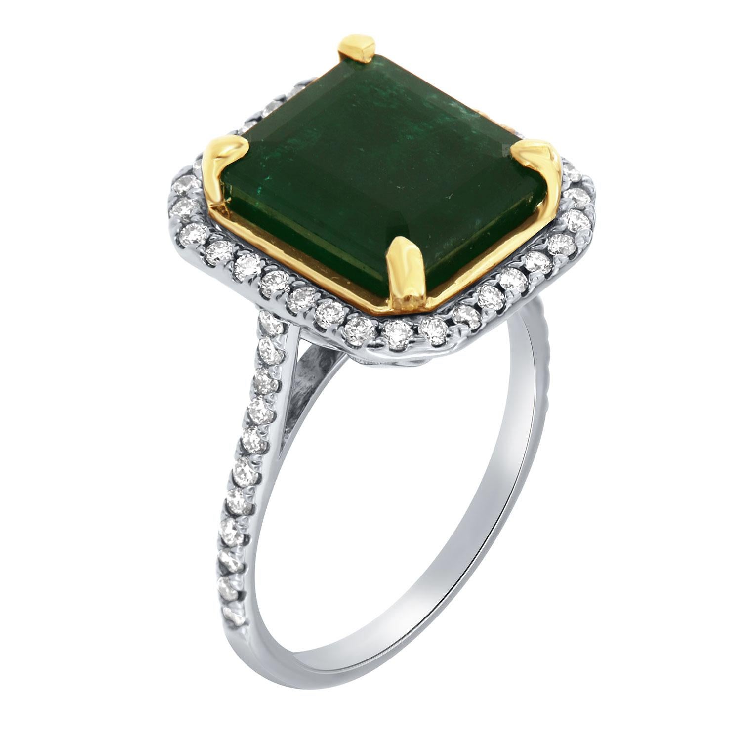 This 14K White and Yellow gold ring feature a 4.52 Carat Emerald cut Natural Green emerald from Zambia. Excellent deep green color. The emerald is encircled by a halo of brilliant round diamonds on a 1.5 mm band. The diamonds are Micro-Prong set on