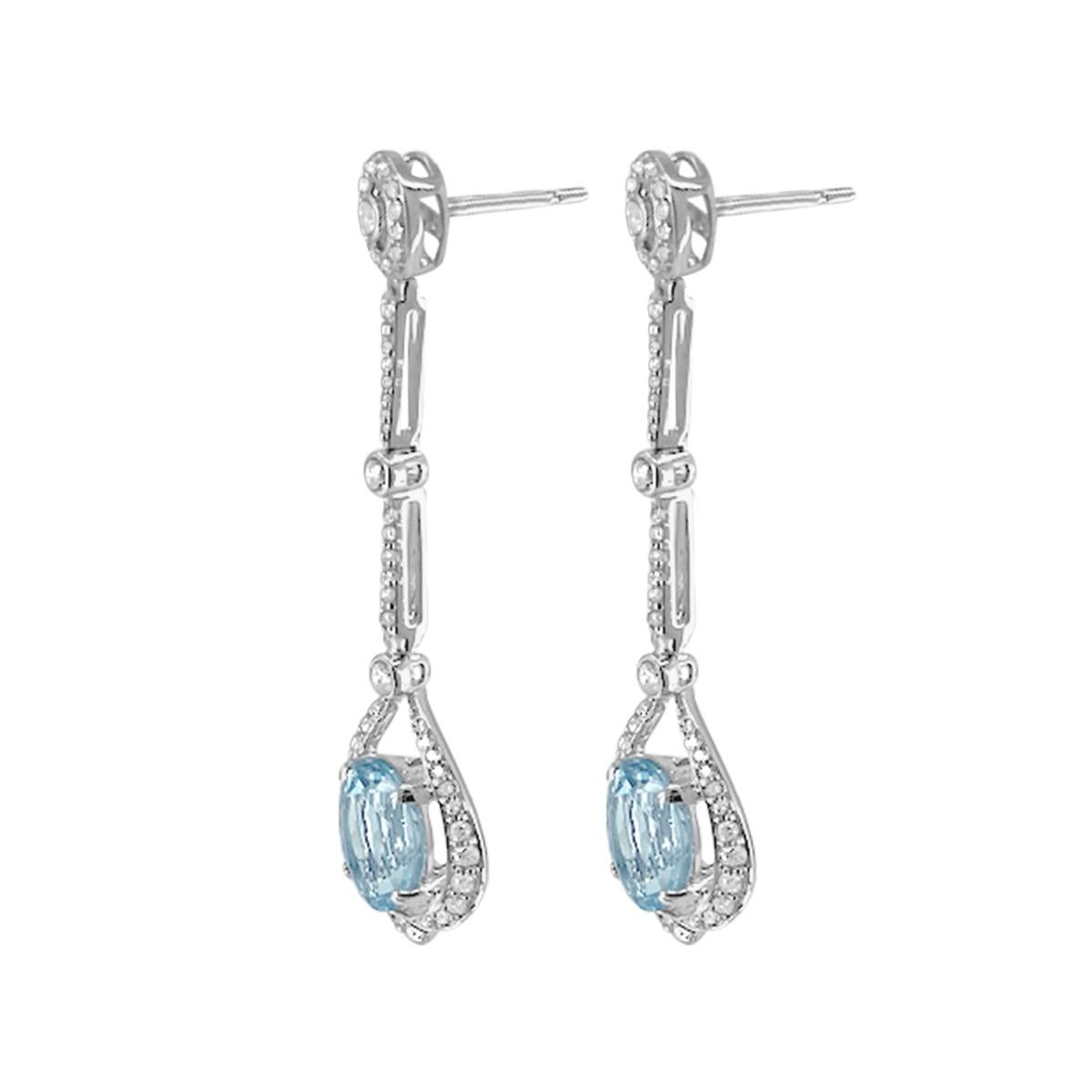 This Elegant And Exquisite Drop/Dangle Earring Will Win The Heart By These Beautiful March Birth Stones. The Eye Is Drawn To The 10x8mm Icy-Blue Aquamarine Centre Stones Of 4.63Cts. Each is Bordered With Diamonds Perfectly Settled In 14K White Gold.