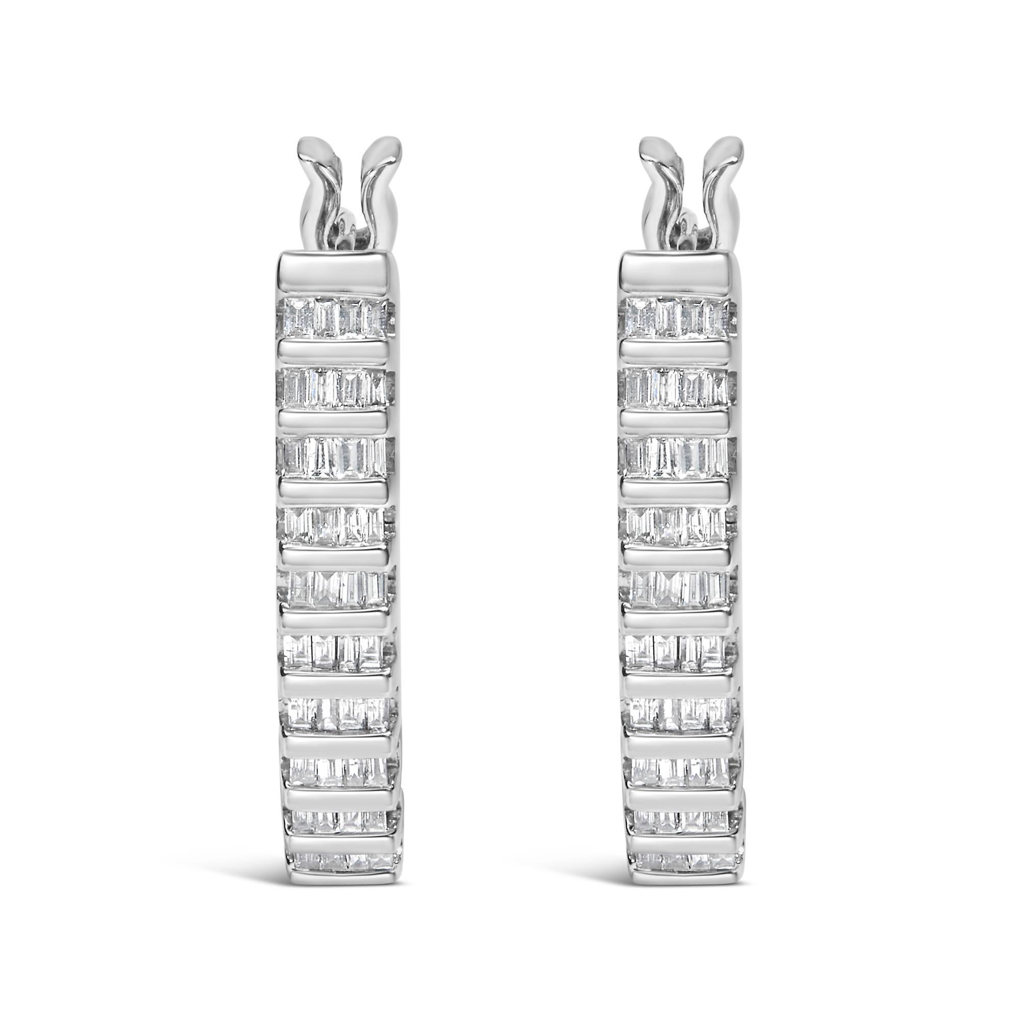 Immerse yourself in the understated elegance of these meticulously crafted hoop earrings, forged in radiant 14K white gold and enhanced with a rhodium finish for an unprecedented shine. These heirloom-quality hoops gracefully dangle at 4/5 of an