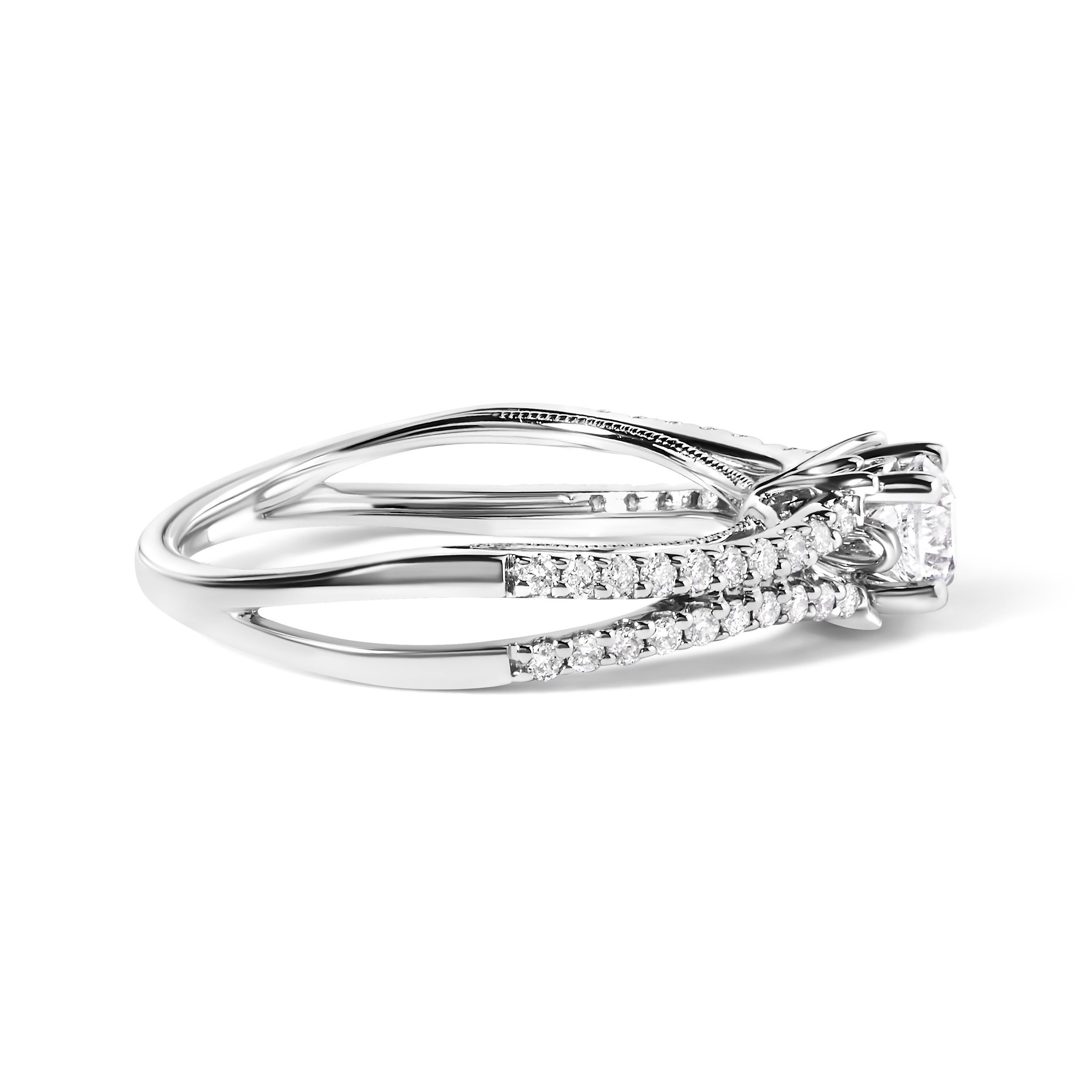 Envision a symphony of light encircling her finger, with this exquisite 14K white gold engagement ring, rhodium-plated for a mirror-like sheen. At the core of this splendid piece, a 1/3 carat, round brilliant cut natural diamond gleams majestically
