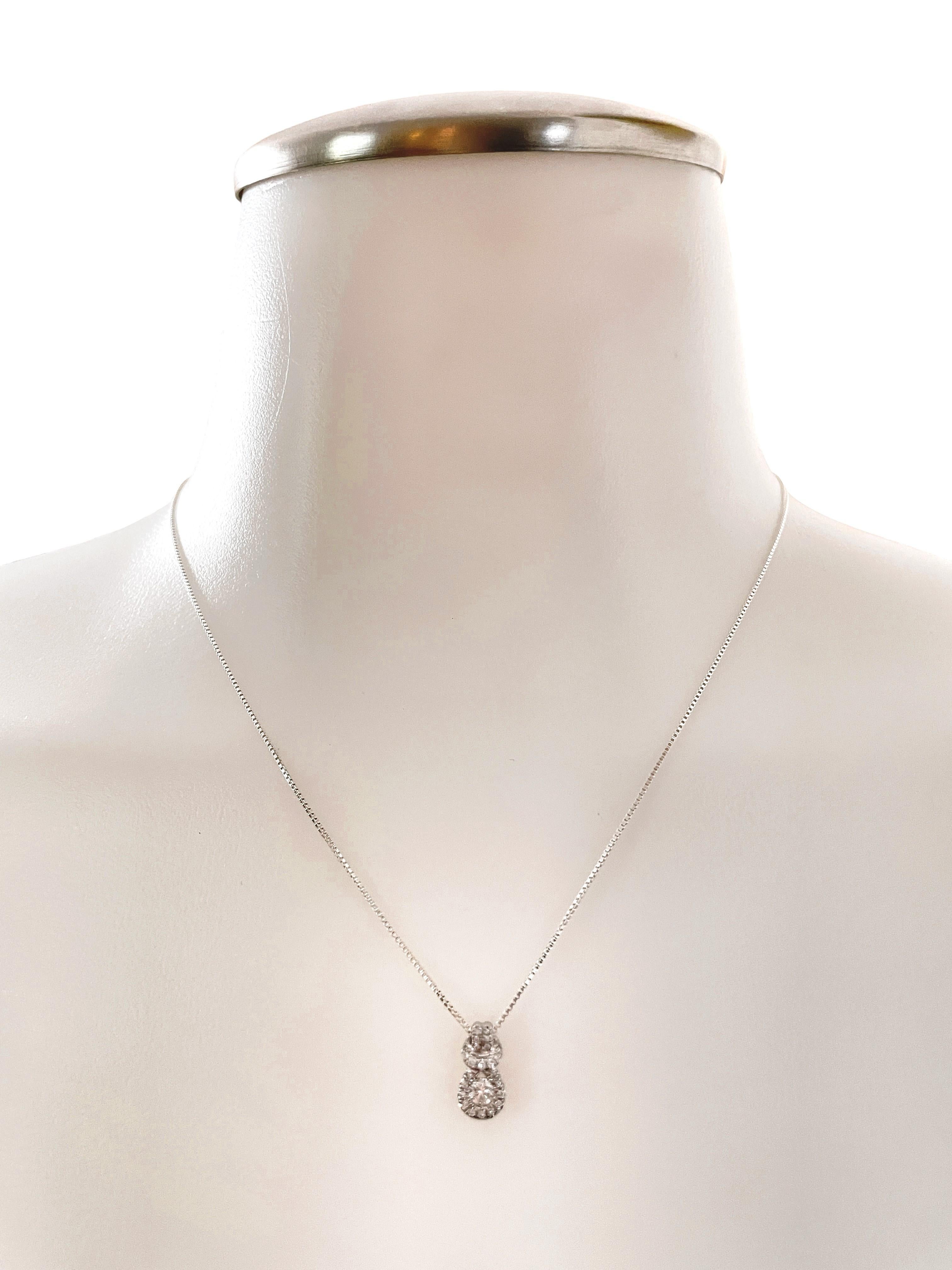 This is a beautiful pre-owned diamond pendant that is in excellent condition.  It is stamped 