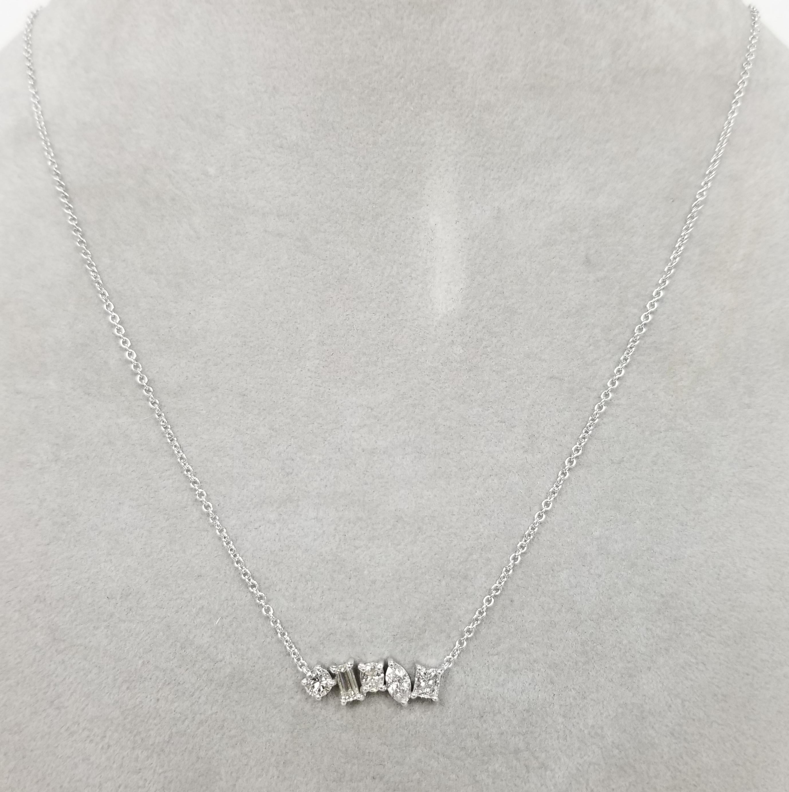 14k white gold 5 different cut  prong set diamond necklace with 1.20cts. in diamonds
Specifications:
    main stone: ROUND DIAMONDS
    SIDE STONE: 5 PCS ROUND CUT DIAMONDS
    carat total weight: 1.20 CTW
    color: G
    clarity: VS2-SI1
   