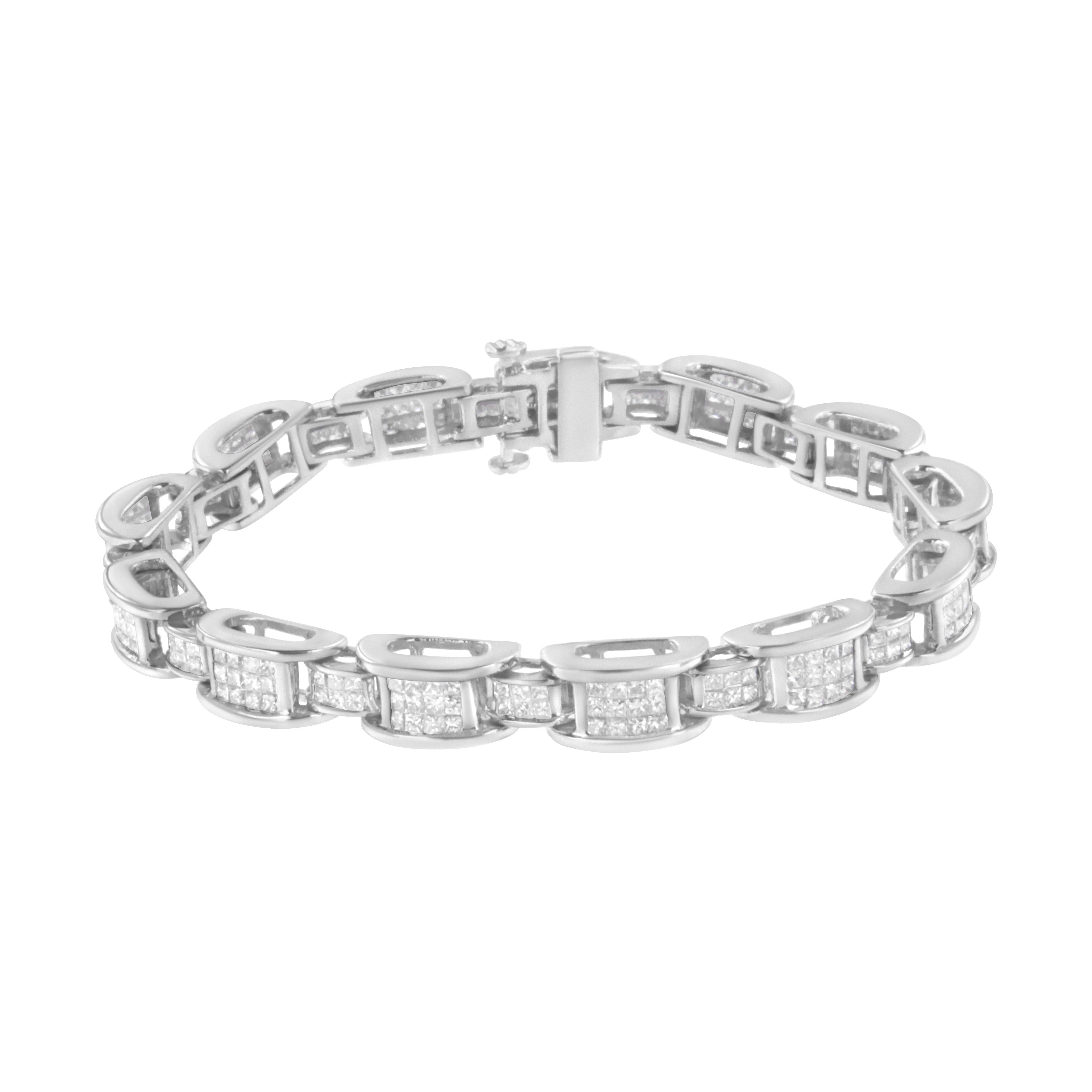 A must have for any serious jewelry collection, this stunning 14K white gold tennis bracelet boasts an impressive 5.0 carat total weight of diamonds. The bracelet features D or bridge shaped links that alternate between large and small sizes both