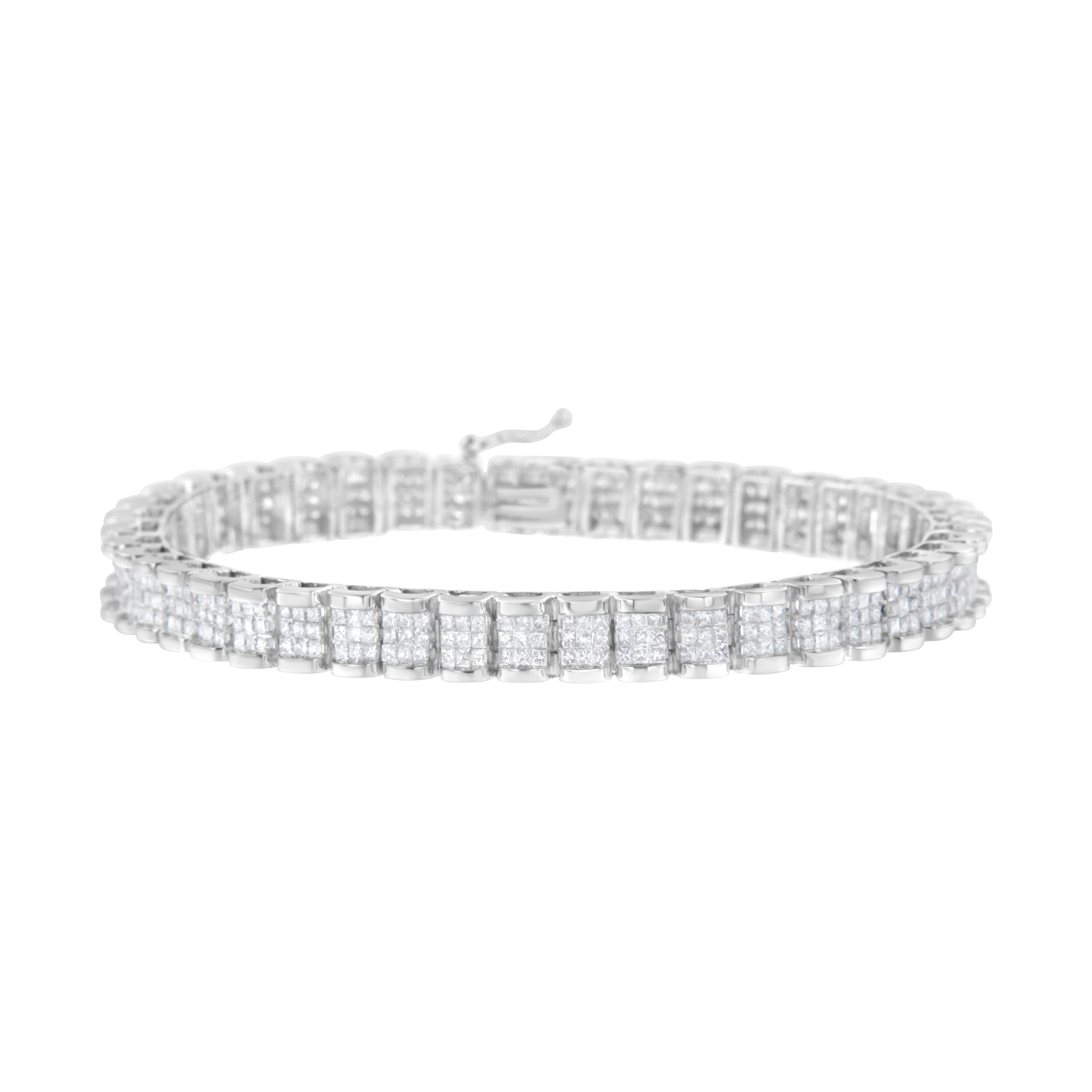 This stunning 14k white gold tennis bracelet is created with 5 ct of beautiful, natural diamonds. Rectangular links, each set with 12 princess-cut diamonds in an invisible setting, comprise the base of this design. This gorgeous piece will sparkle