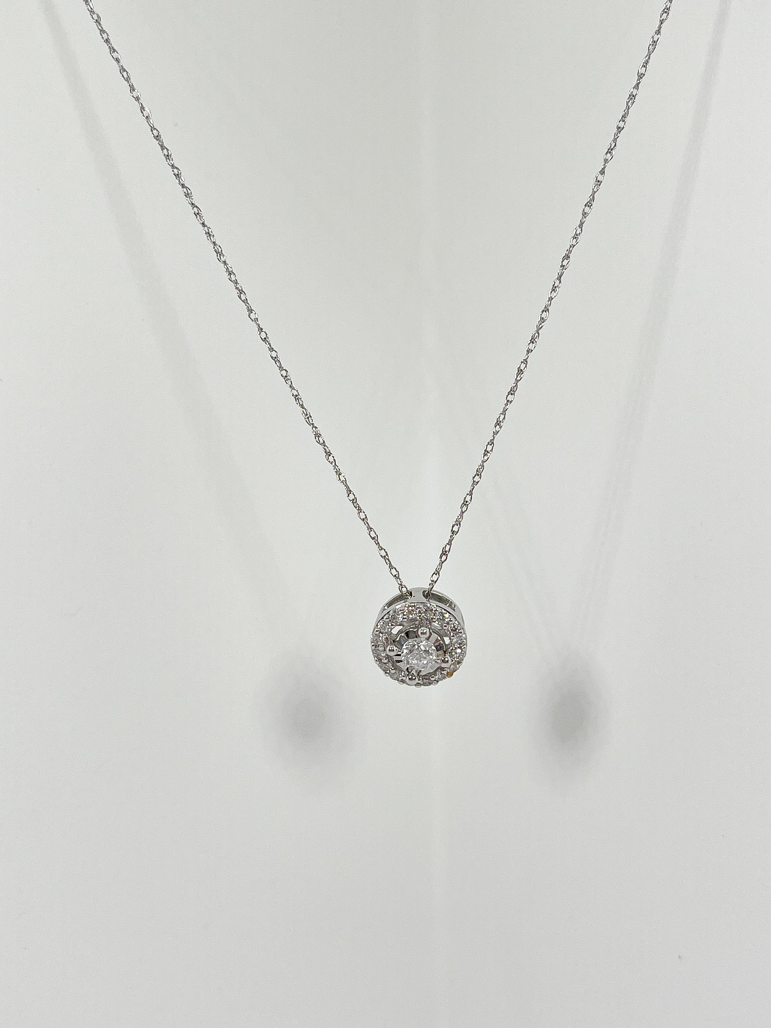 14k white gold .50 CTW diamond halo pendant necklace. Pendant comes on a Singapore chain, has a diameter of 9.1, the necklace has a length of 18 inches, and a total weight of 1.87.