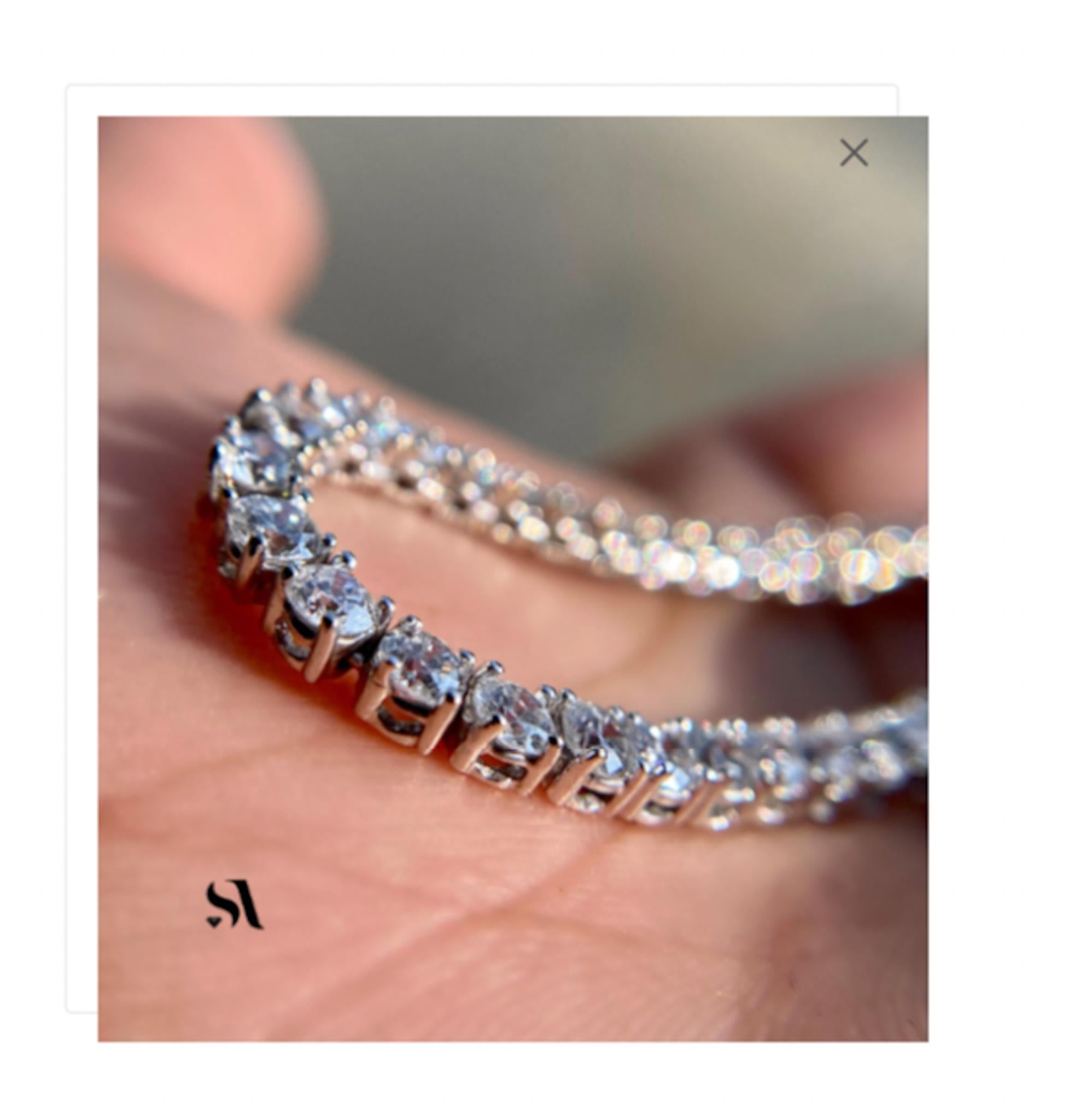 14K White Gold 5.10 ct Round Diamond Tennis Necklace

This is a beautiful and elegant diamond tennis necklace. It is made with 227 shimmering white diamonds. This tennis necklace is the perfect statement piece, and  can be worn in any occasion or