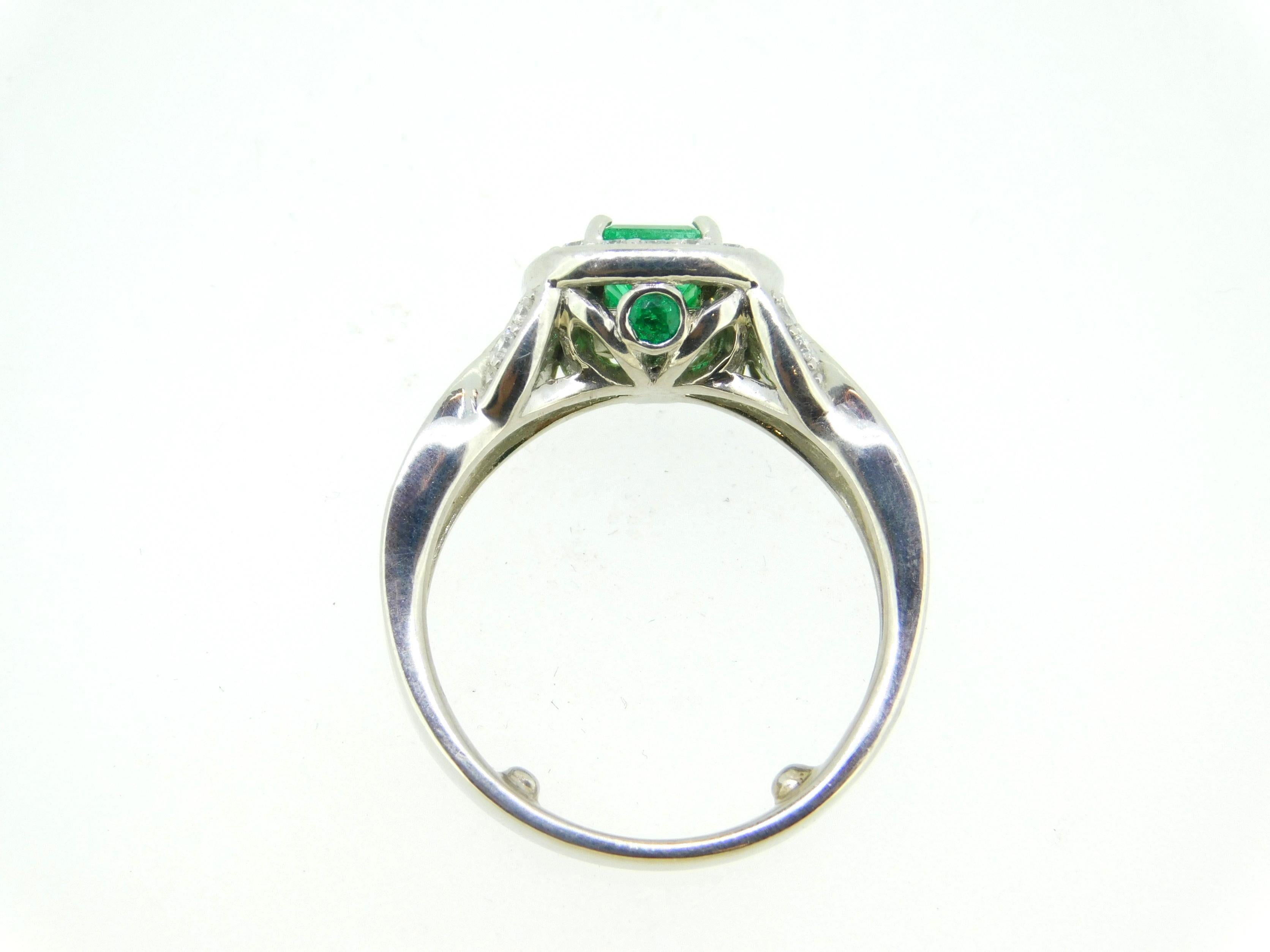 Contemporary 14k White Gold .56ct Genuine Natural Emerald and Diamond Halo Ring '#J5003' For Sale