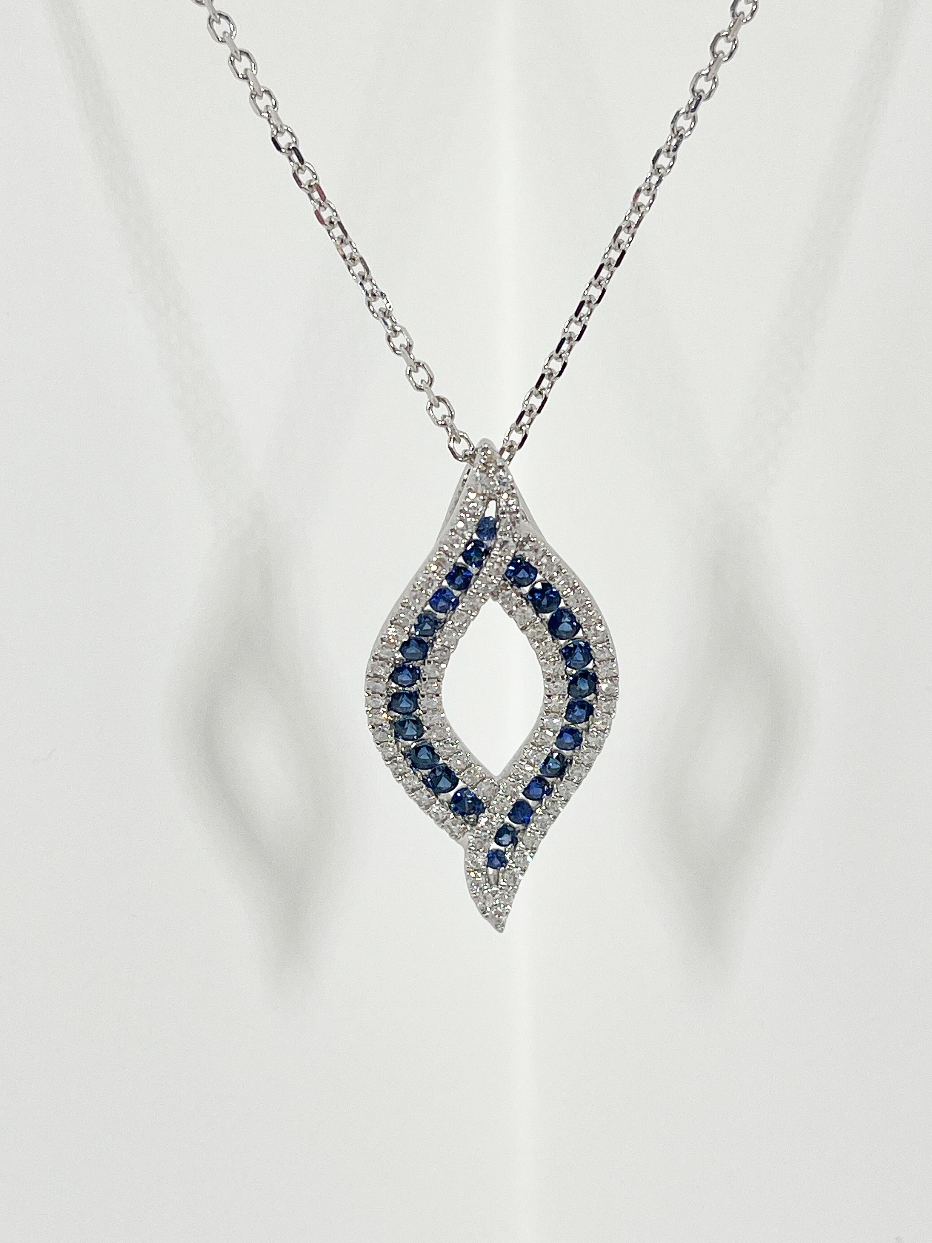 Round Cut 14K White Gold .57 CTW Diamond and .78 CTW Sapphire Pendant Necklace. For Sale