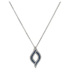 14K White Gold .57 CTW Diamond and .78 CTW Sapphire Pendant Necklace.