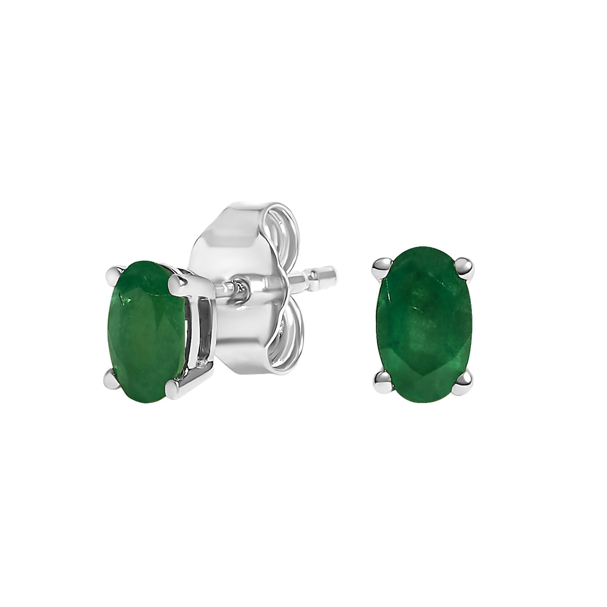 Immerse yourself in the splendor of these resplendent stud earrings, each adorned with a natural, oval-cut green emerald, elegantly cradled in the cool embrace of 14K white gold. At 5x3 mm, these emeralds have been thoughtfully oiled to enhance