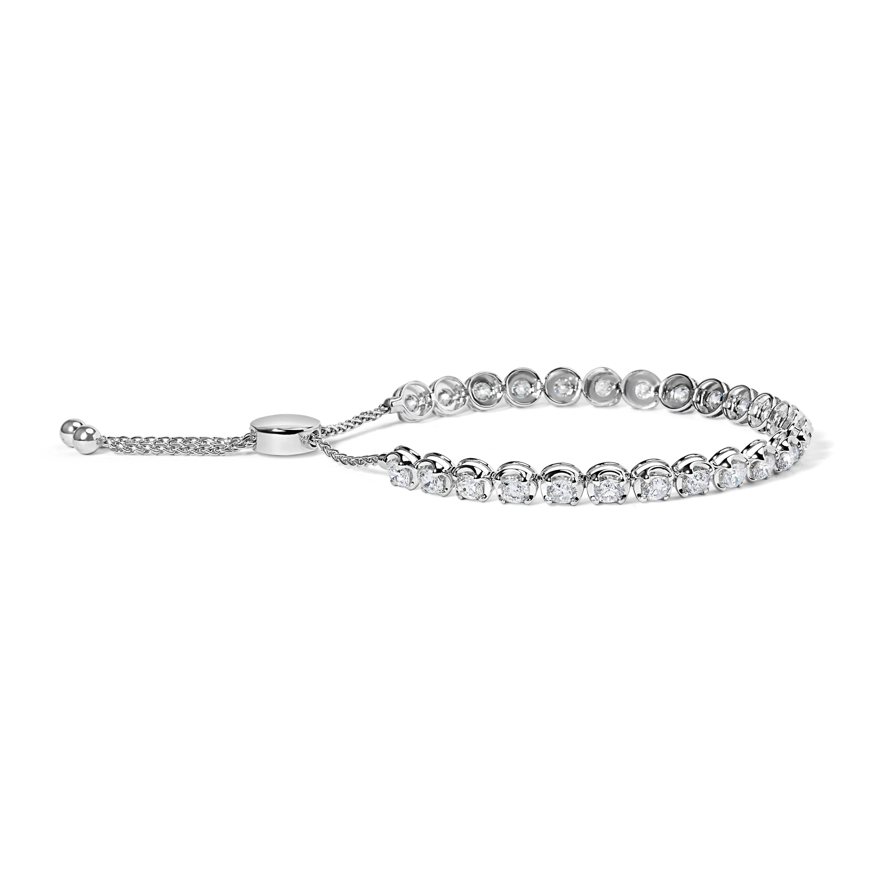 Indulge in the epitome of sophistication with our Diamond Adjustable Bolo Tennis Bracelet. Crafted from radiant 14K white gold, it exudes timeless elegance. Adorned with 25 natural round diamonds totaling 6.0 cttw, they shimmer with undeniable