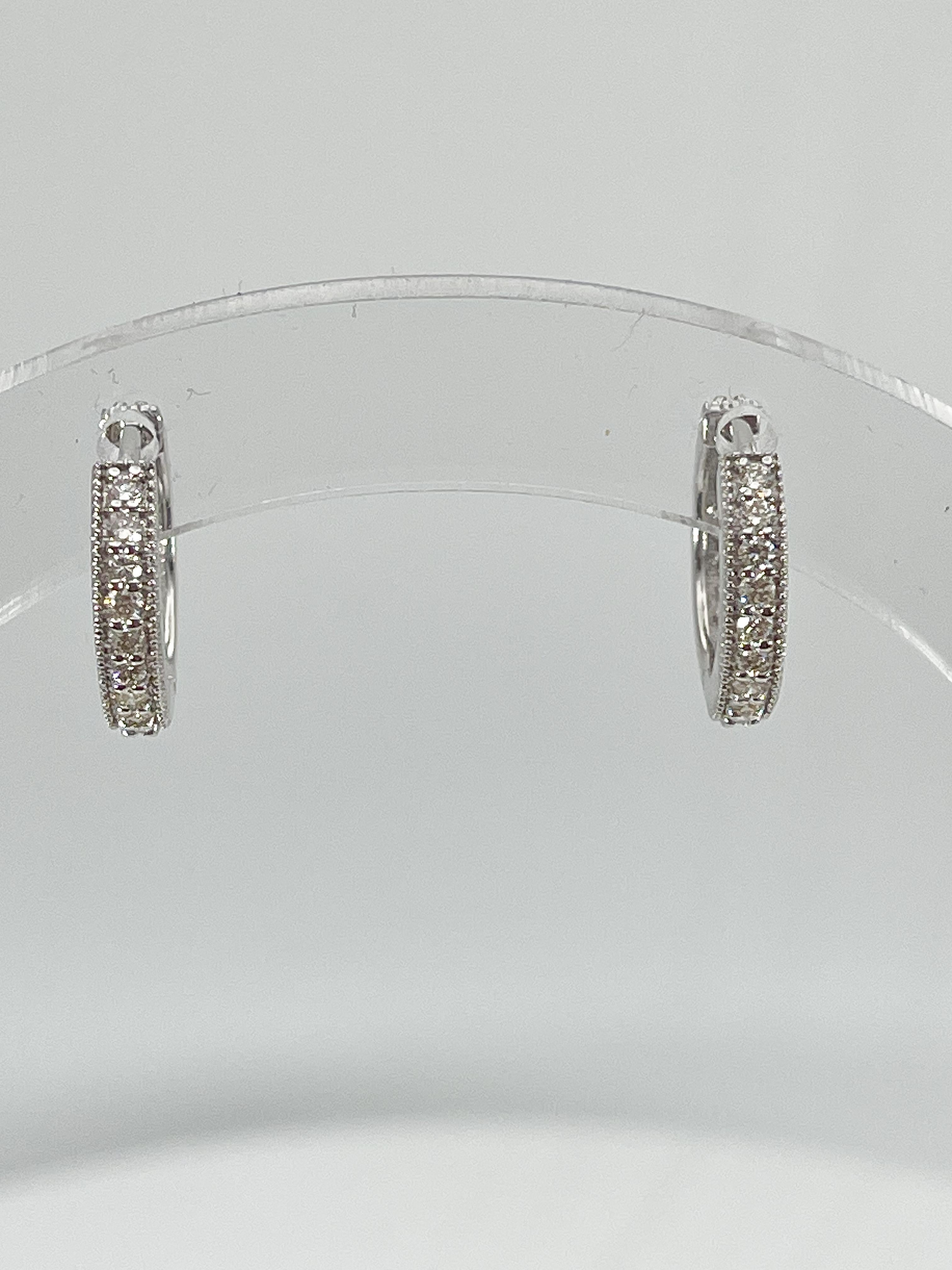 14K White Gold .60 CTW Diamond Huggie Hoops In Excellent Condition For Sale In Stuart, FL