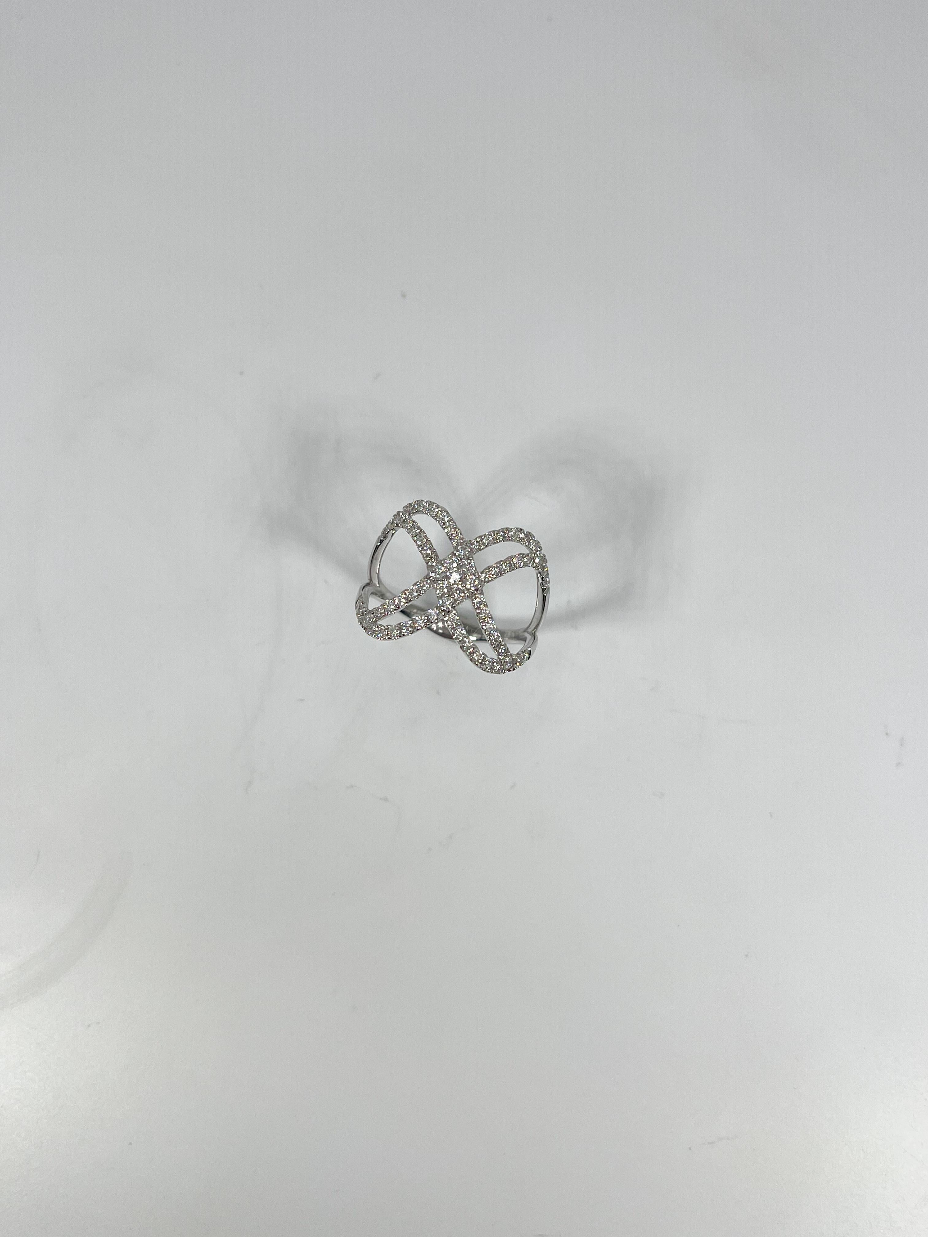 14k white gold .63 CTW contemporary diamond ring. The diamonds in this ring are all round, ring is a size 6 3/4, the width is 15 mm, and it has a total weight of 2.9 grams. 