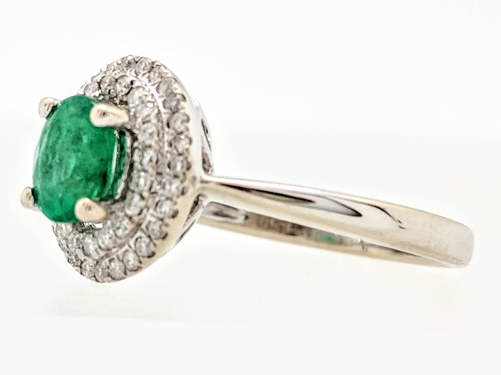 Contemporary 14 Karat White Gold .66 Carat Emerald and Diamond Double Halo Ring