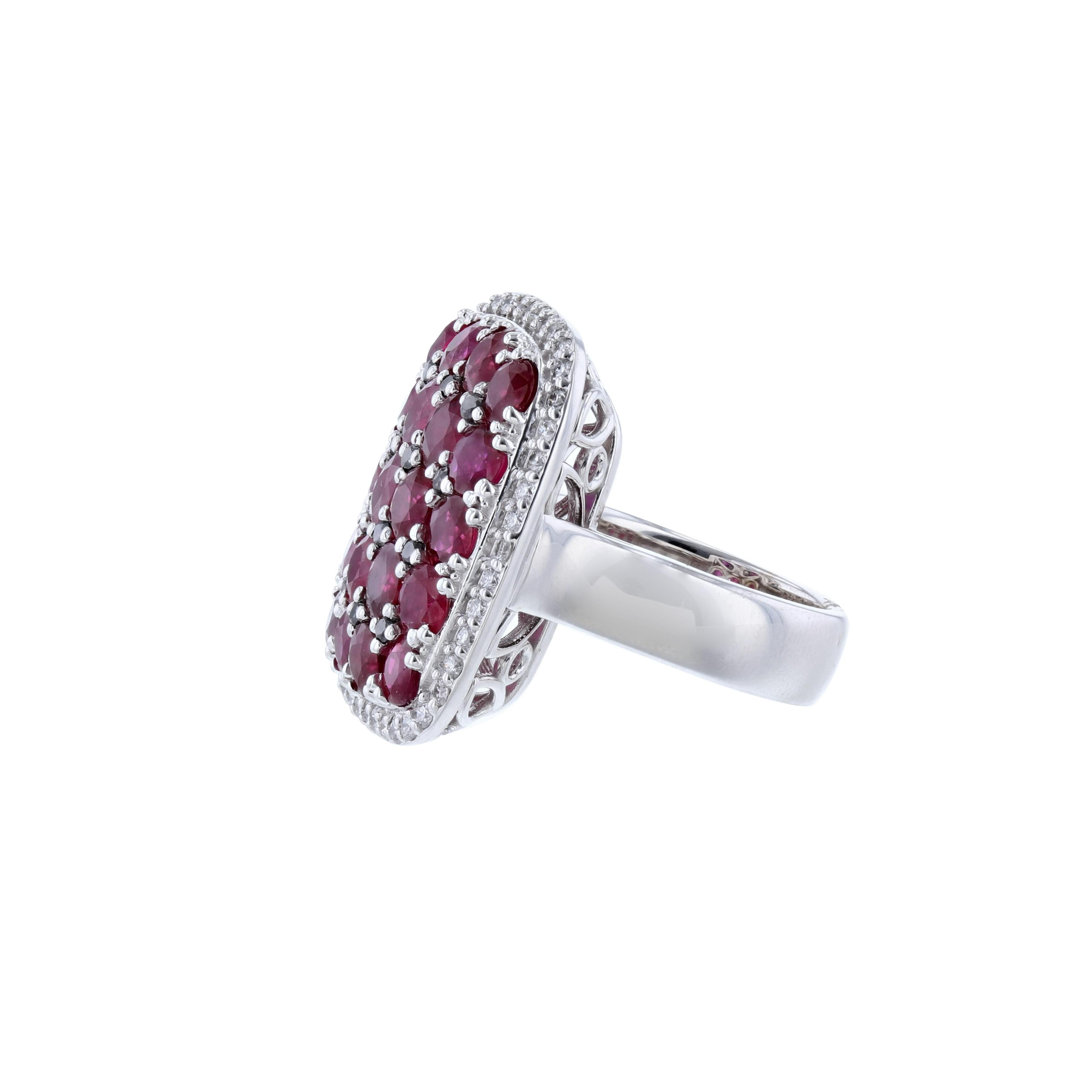 This ring is 14K white gold and features 20 round cut rubies and 12 heat treated, black diamonds. Surrounded by 44 round cut diamonds. All stones are prong set and weigh 7.81 carats combined.