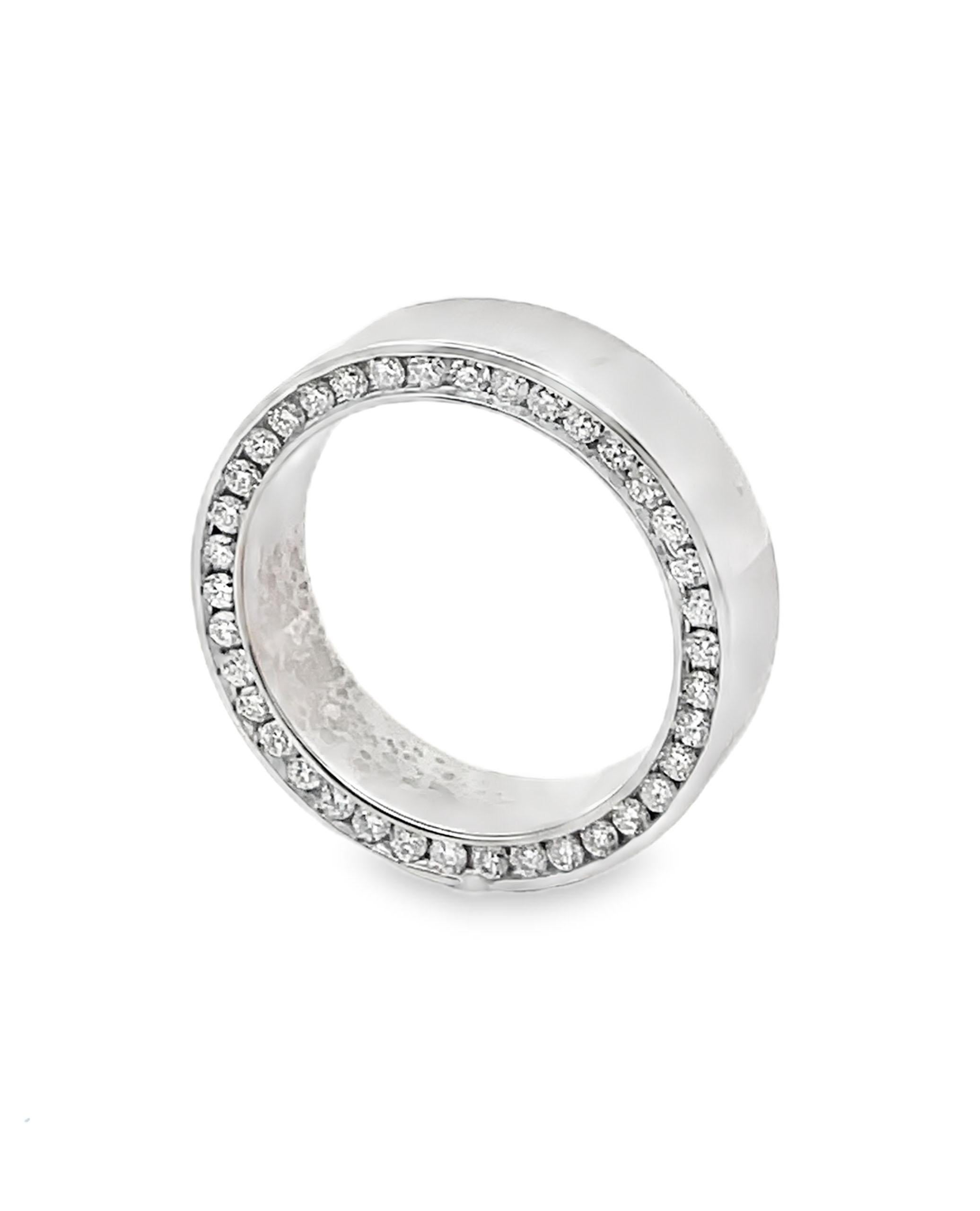 14K White Gold 7mm Wide Wedding Band with 78 Channel Set Diamonds 1.70 carats.

- Diamonds are G/H Color, SI1 Clarity.
- Finger size 10.5