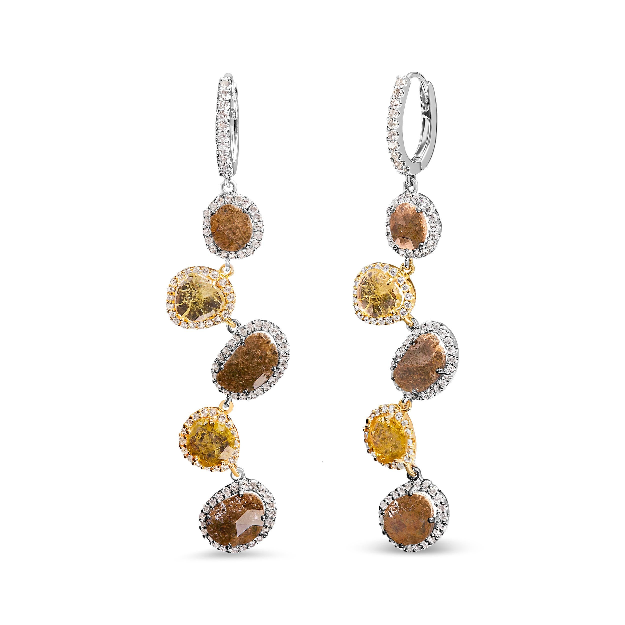 Introducing our captivating drop and dangle earrings, expertly crafted from 14K white gold and adorned with an exquisite combination of fancy brown and yellow diamonds. With a total weight of 8 5/8 carats, these earrings are an impressive statement