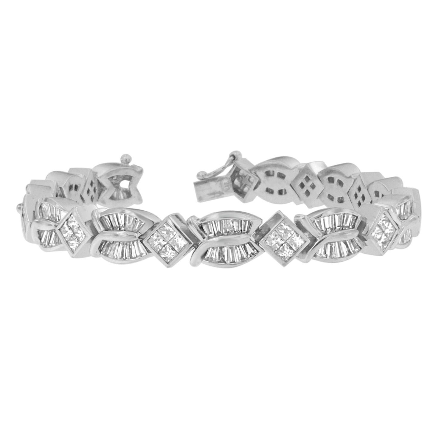 The rich texture of this 14 karat white gold bracelet is what makes it so uniquely charming. Featuring over 8 carats of princess and baguette cut diamonds, each intricate twist and turn was designed to catch the light, inspiring plenty of envious