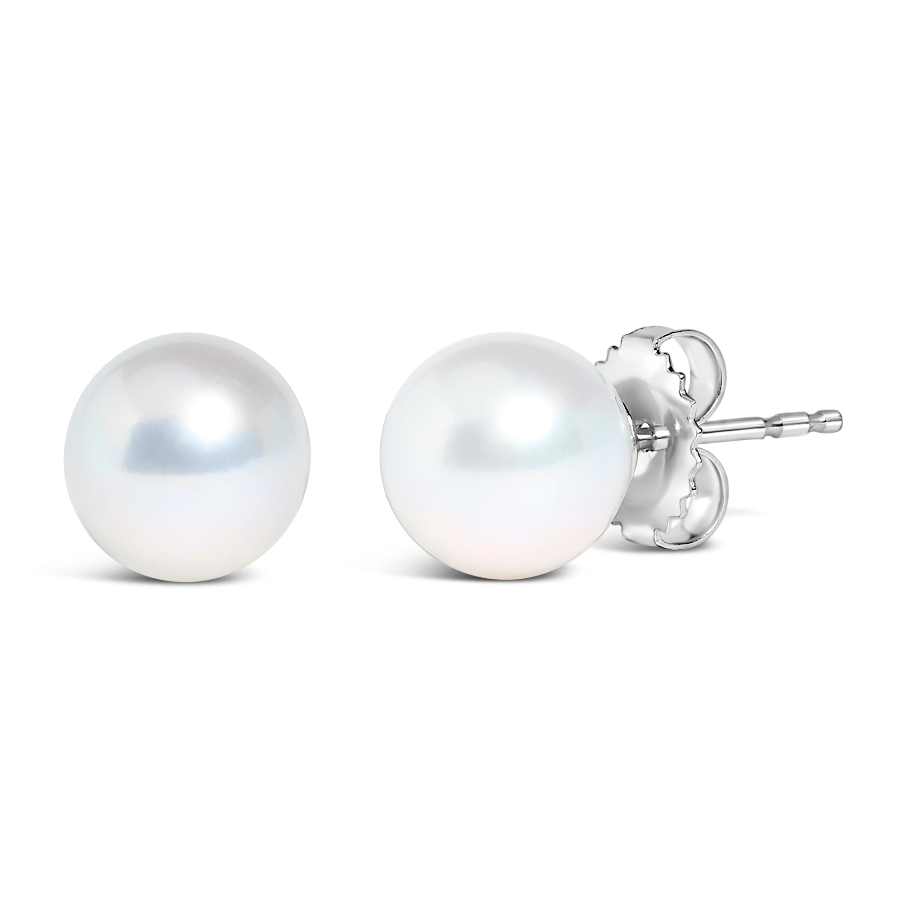 Discover the understated elegance of these exquisite cultured freshwater pearl stud earrings, a testament to classic style and timeless craftsmanship. Each pearl, nestled in a polished cup of rhodium-enhanced 14K white gold, measures a generous