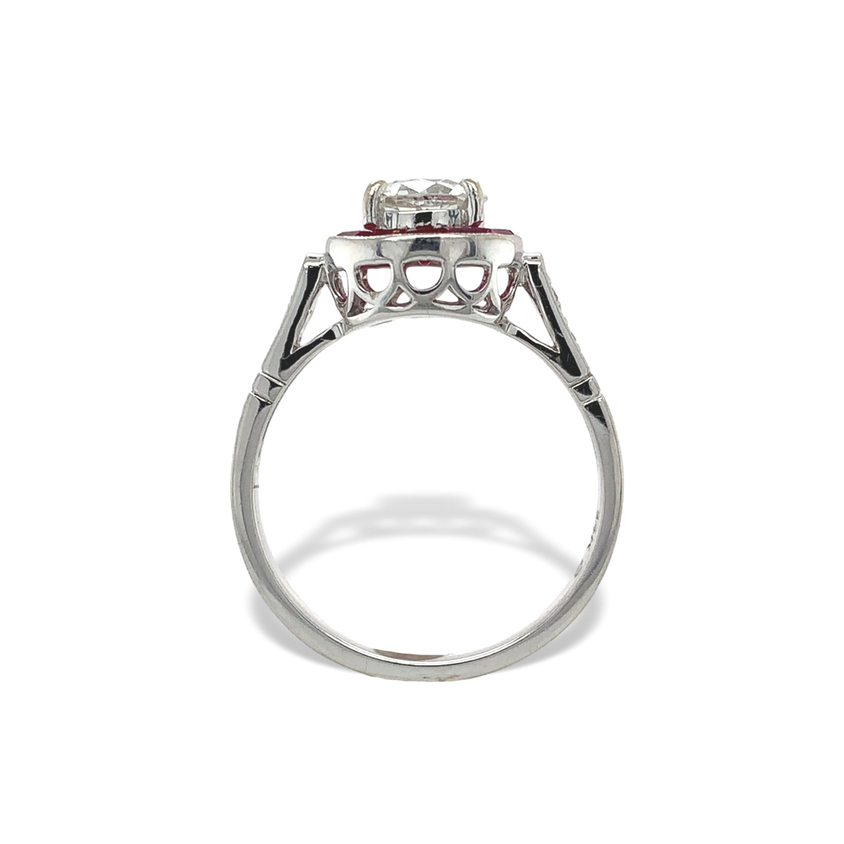 14K white gold ring made in Art Deco style featuring diamonds and rubies. In the center an European cut diamond weighing about .80cts and measuring 6.1mm x 6.2mm x 3.5mm. The diamond has H-I color and SI2-I1 clarity. The diamond has a chip. There is