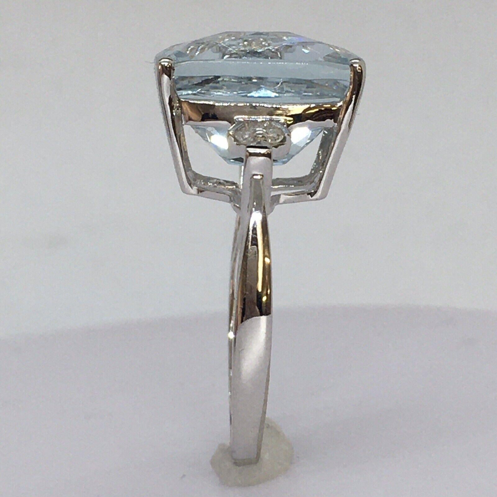 
14k White Gold 8.5 Carat Natural Aquamarine Diamond Statement Ring Size 8.5


Size 8.5
 Aquamarine Rectangular Checker Cut Cushion measures 13.8 mm by 11.9 mm by 9.1 mm, calculated to be 8.80 Carat by measurements 
6 Diamonds, 0.01 Carat each, 0.06