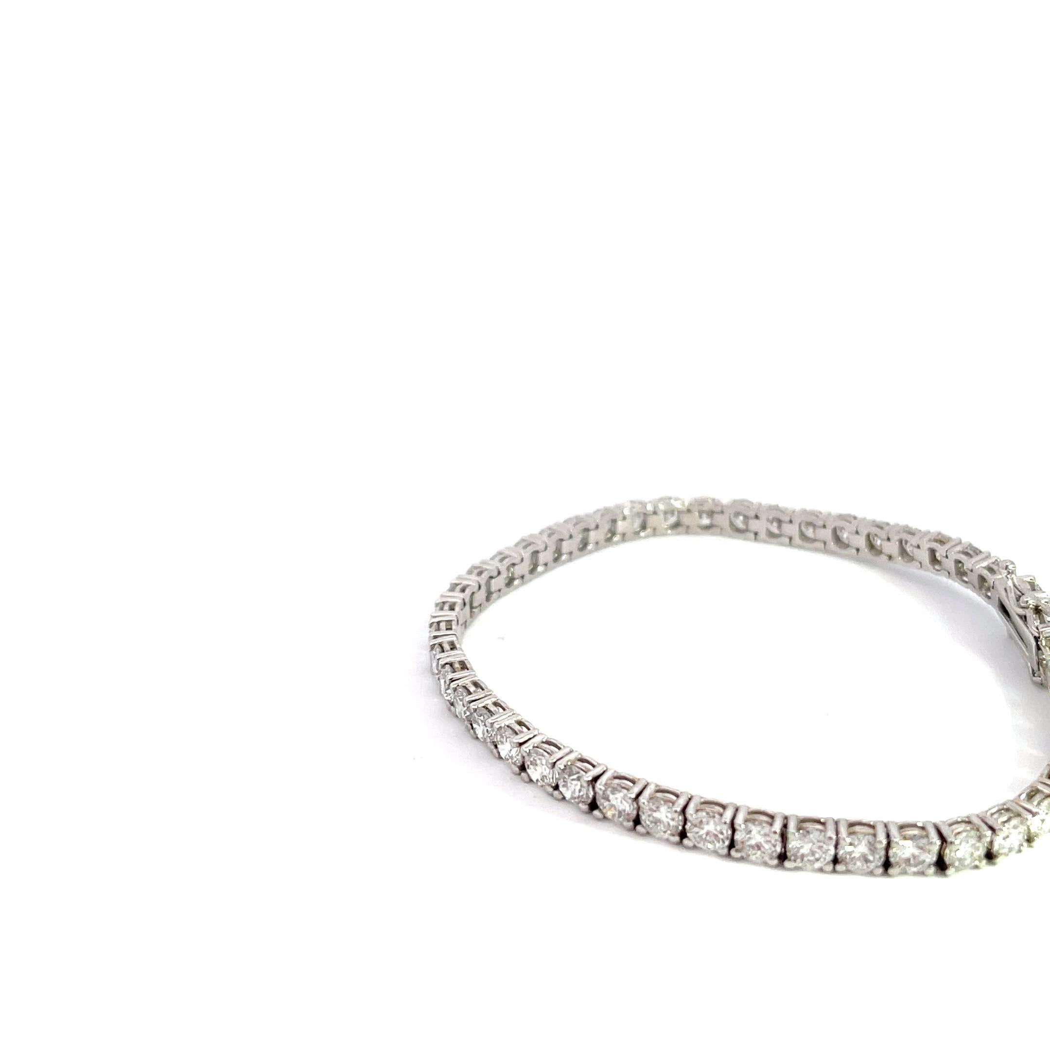 Introducing the exquisite 14k White Gold 8ctw Diamond Tennis Bracelet, a true symbol of timeless elegance and sophistication. This dazzling masterpiece is a must-have for those seeking to make a stunning statement. Crafted with meticulous attention