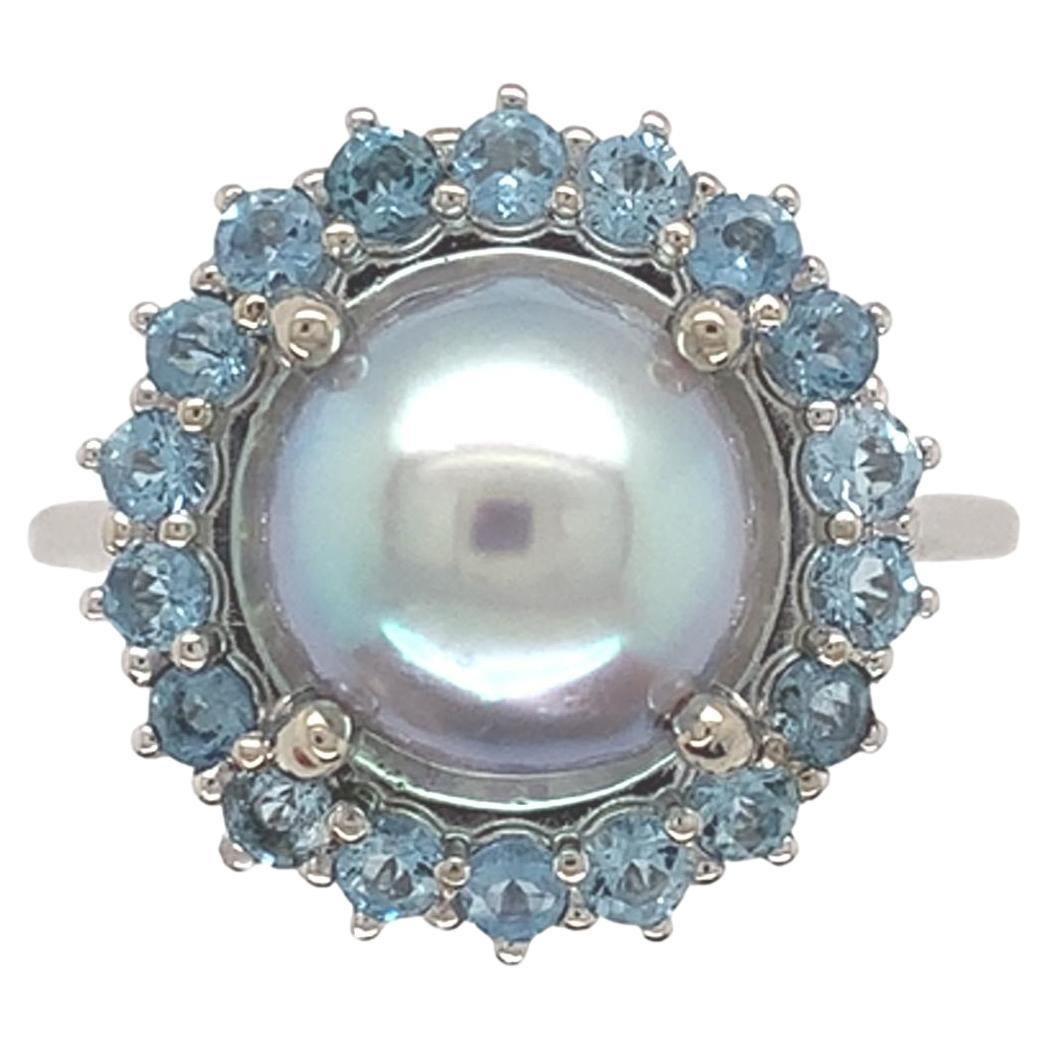 Bague en or blanc 14 carats, perle Akoya bleue de 9 mm et aigue-marine