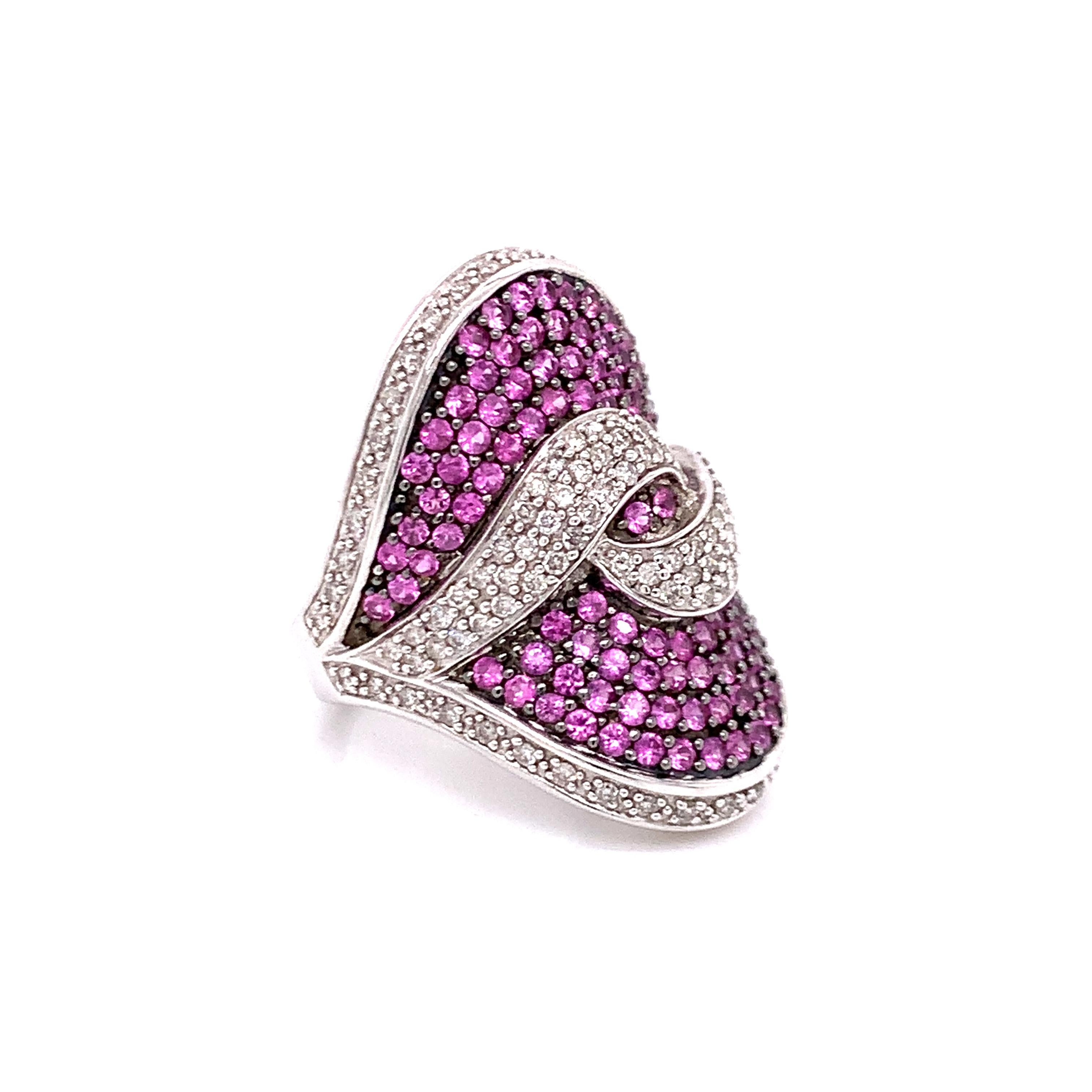 A gorgeous cluster ring containing round-cut amethyst and round-cut diamonds, all set in 14K white gold

Ring size 7