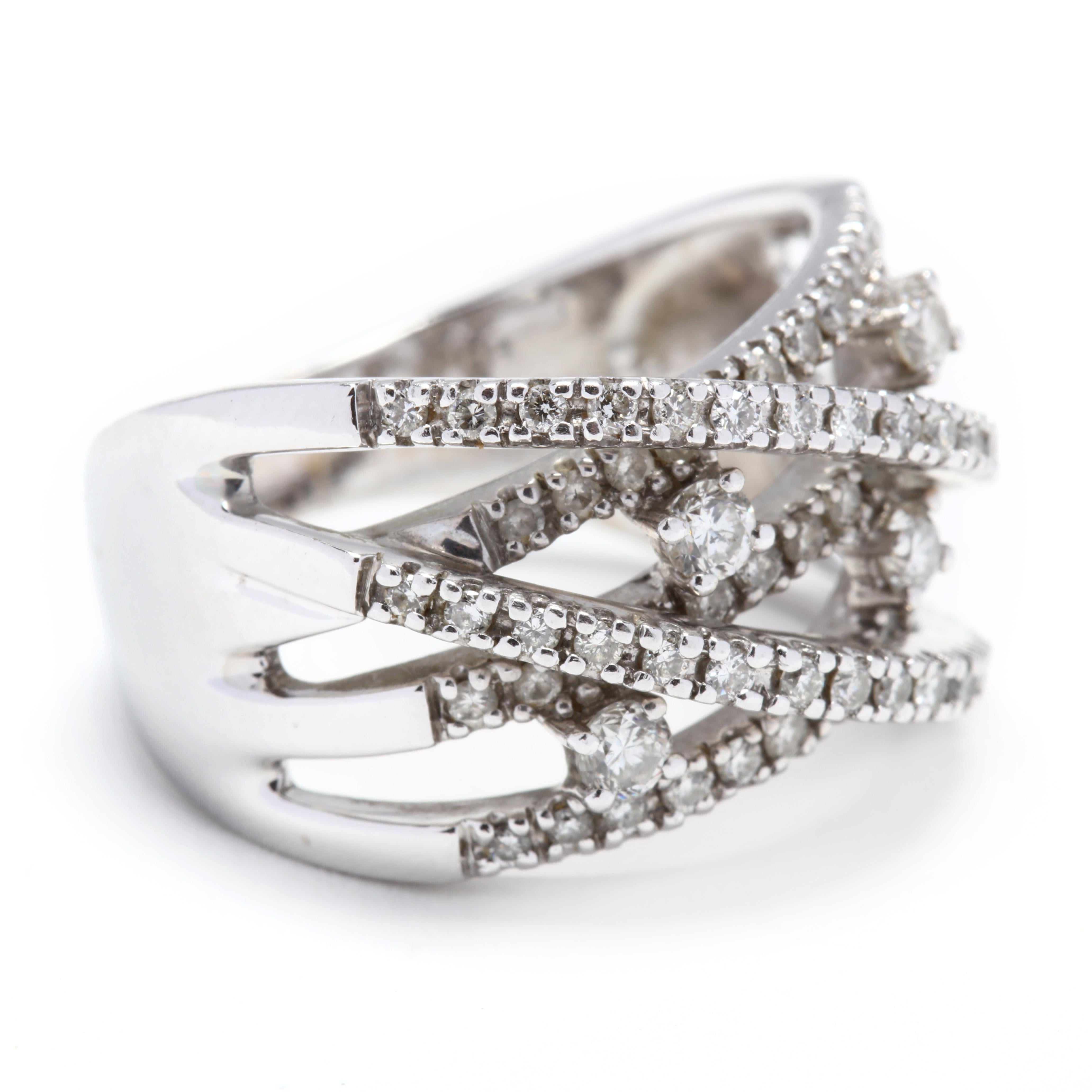 14k white gold and diamond criss cross wide band. A great statement ring! This piece would make a lovely wedding, anniversary or right hand band! It has five bands of white gold set with diamonds that cross over in different directions and four,