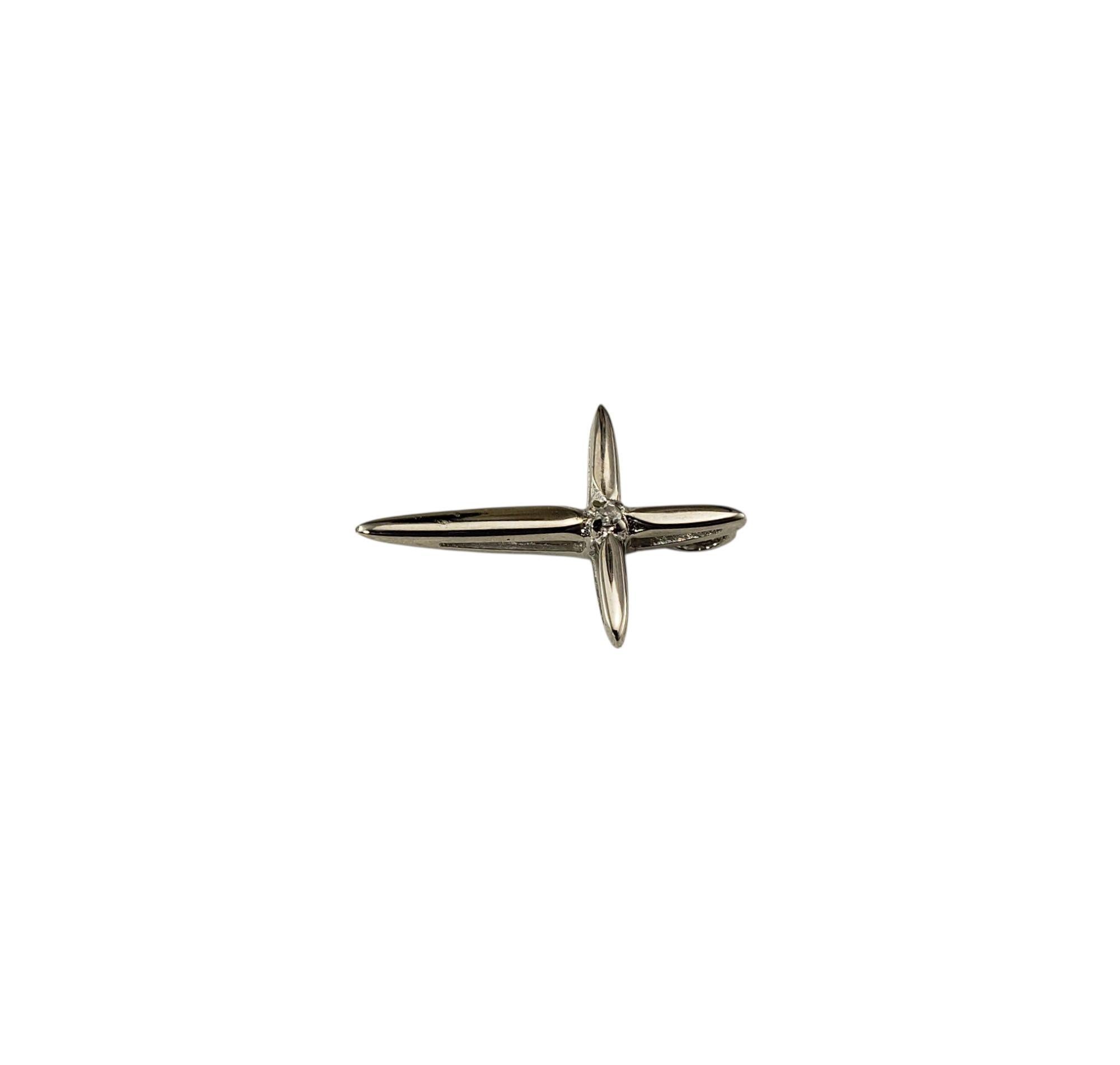 14 Karat White Gold and Diamond Cross Pendant-

A timeless symbol of faith, this 14K white gold cross pendant is accented with one round single cut diamond, adding a touch of sparkle and luxury.

Approximate total diamond weight: .005 ct.

Diamond
