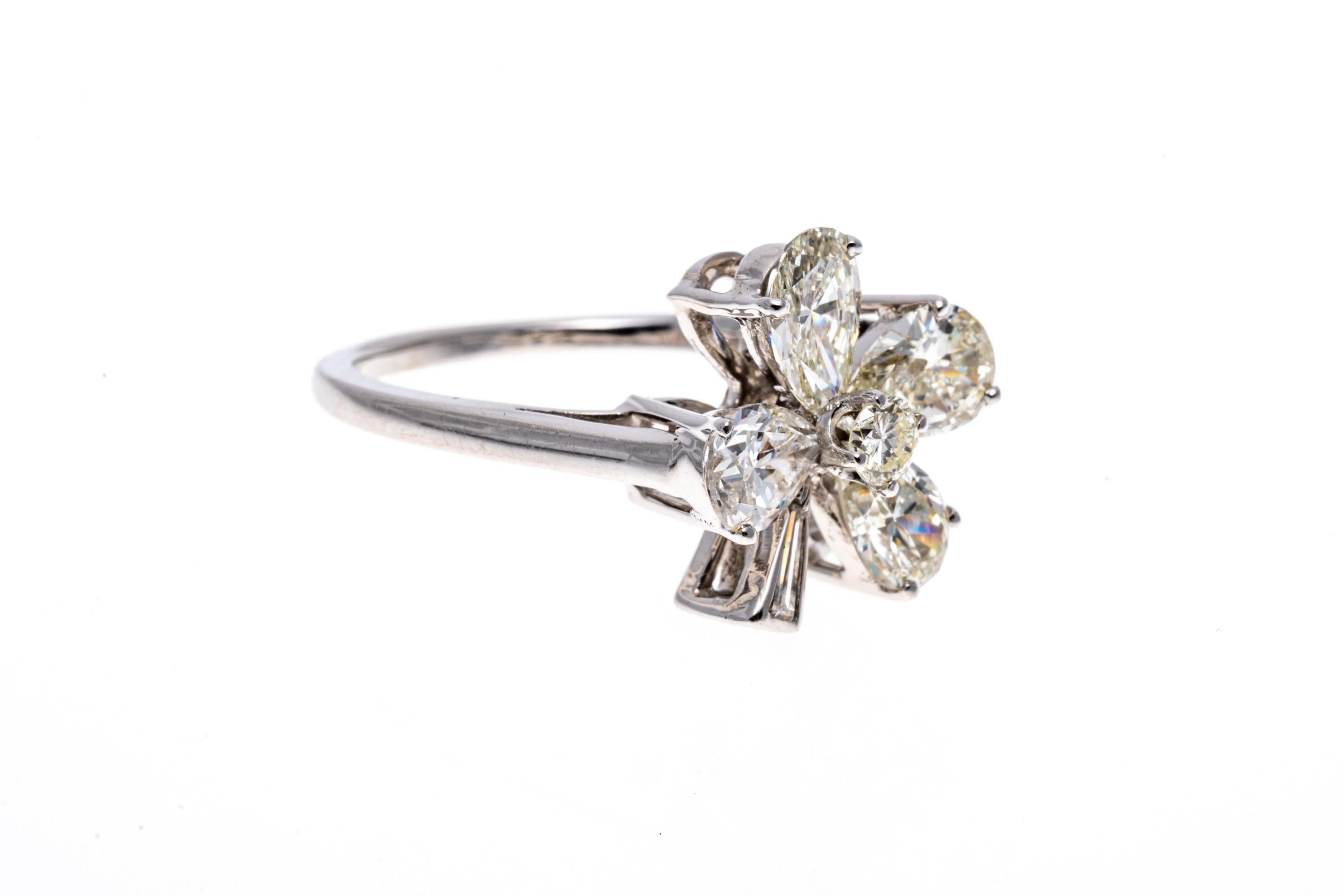 14k white gold ring. This spectacular ring is a four leaf clover motif, set with pear brilliant cut diamond 