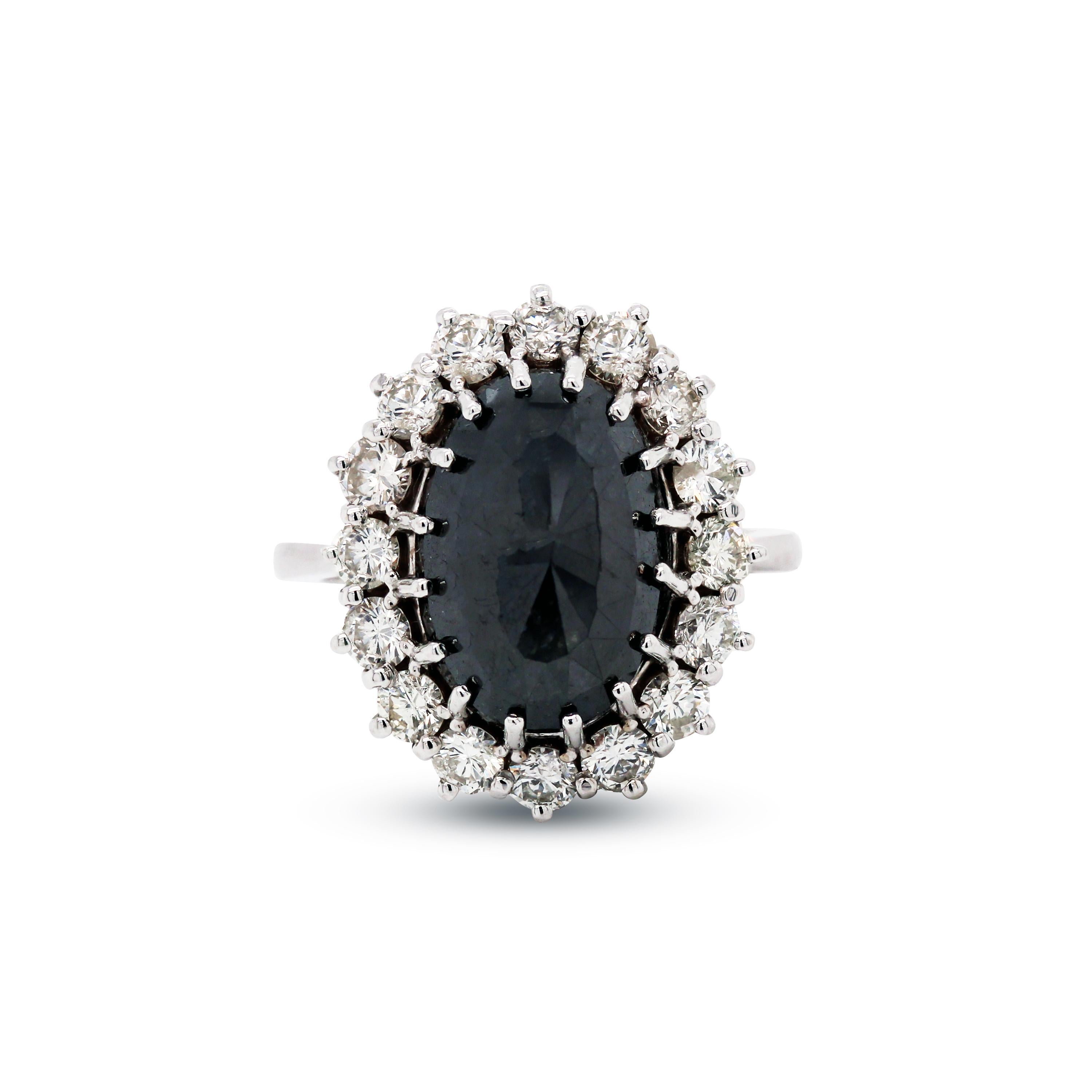 14K White Gold and Diamond Ring with Black Diamond Center

This Handmade ring features an incredibly sized black diamond center prong set with diamonds set all around

Black diamond is oval-cut, 8.70 carat

1 carat G color, VS clarity diamonds total