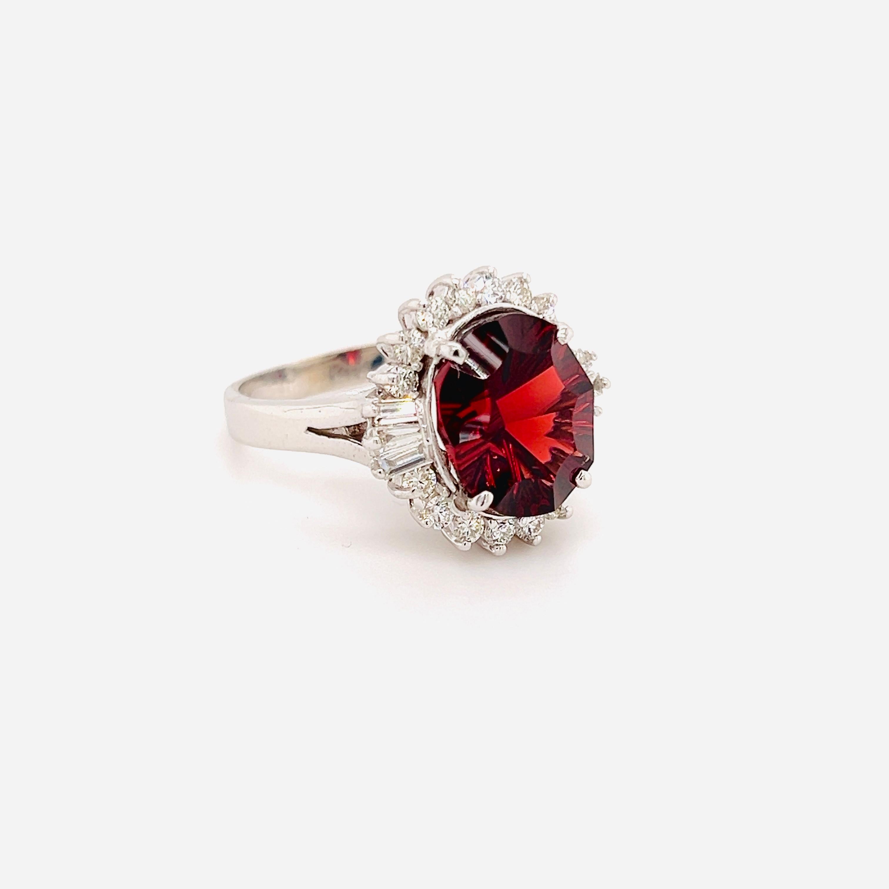 14K White Gold and Diamond Ring with Portuguese Cut Oval Garnet Center

Apprx. 7 carat Portuguese cut, Oval Garnet center

Apprx. 0.70ct. G color VS clarity round and baguette cut diamonds

Ring is a size 7, sizable by request